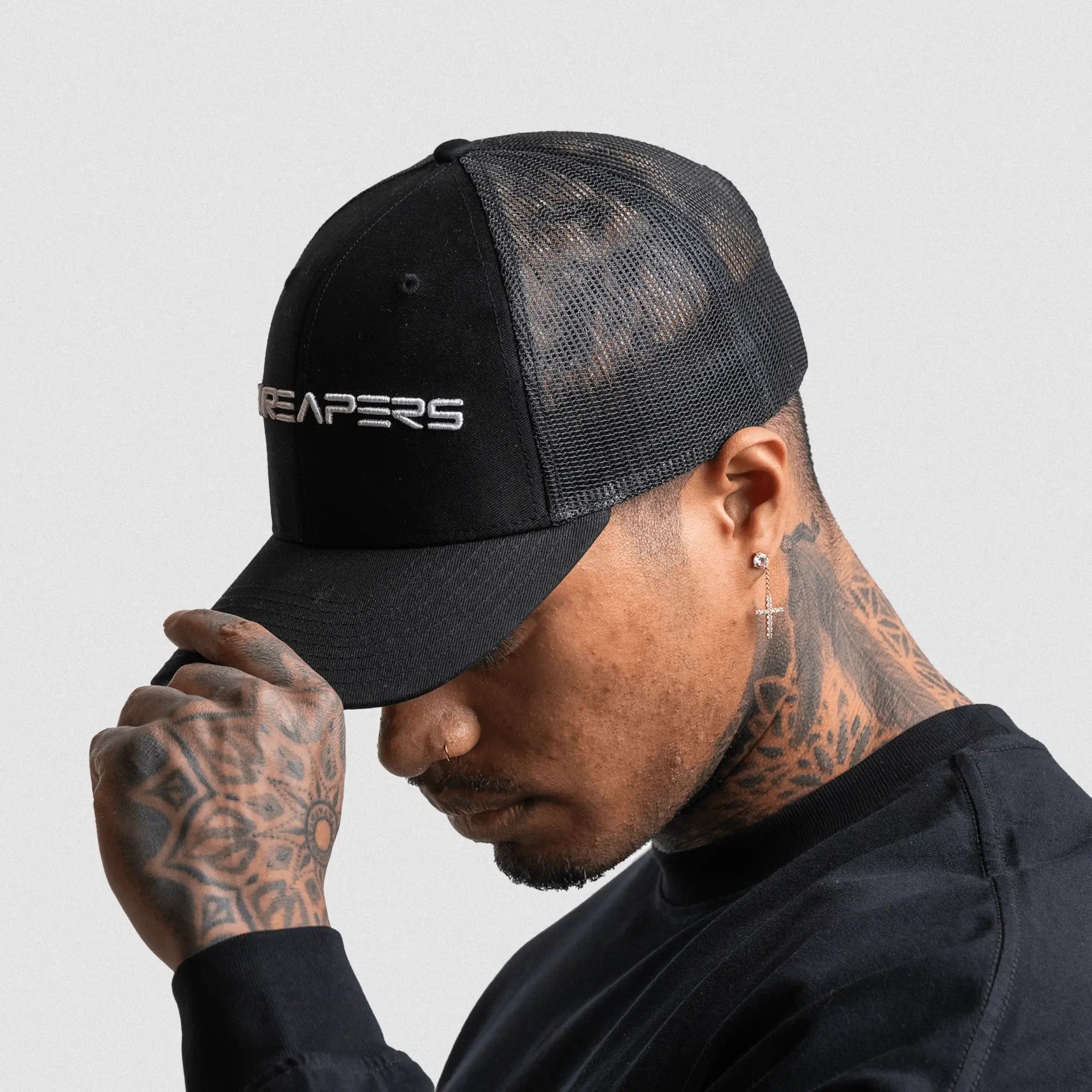 6 panel hat black white on athlete studio gray background side view