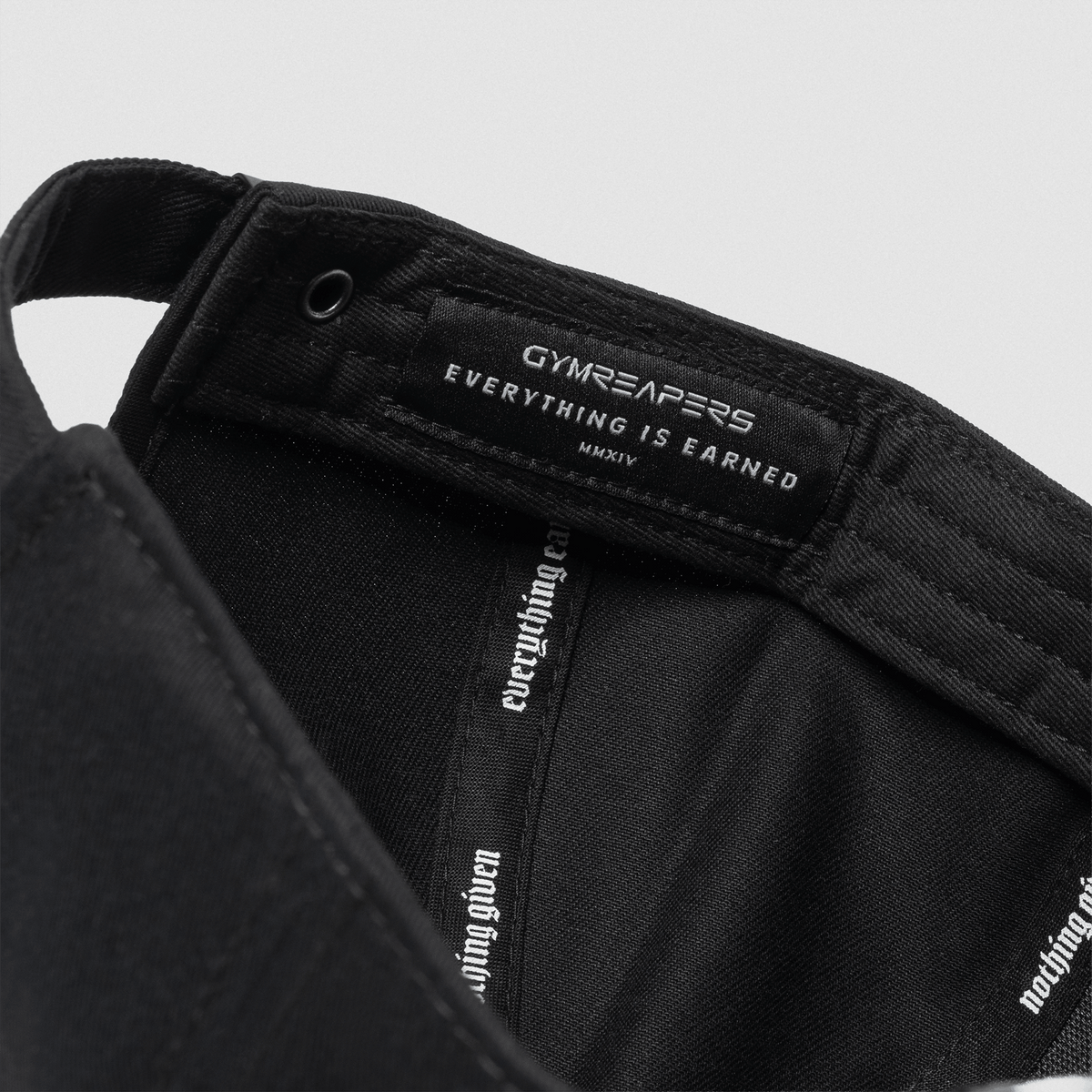 5-Panel Skull Hat in Black/Green – Inside Tag Detail