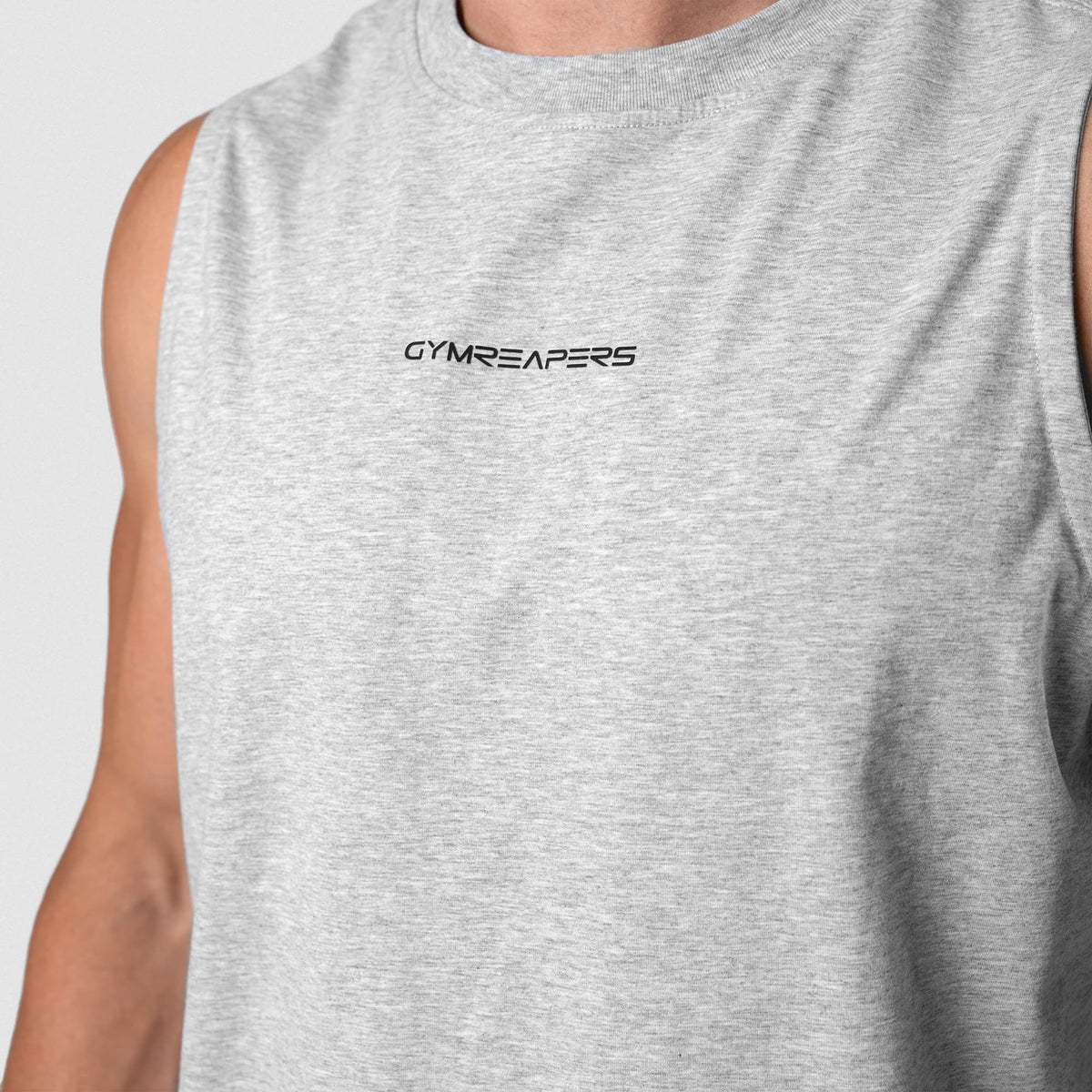 Man wearing Axis Muscle Tank - Heather Gray front chest and logo detail