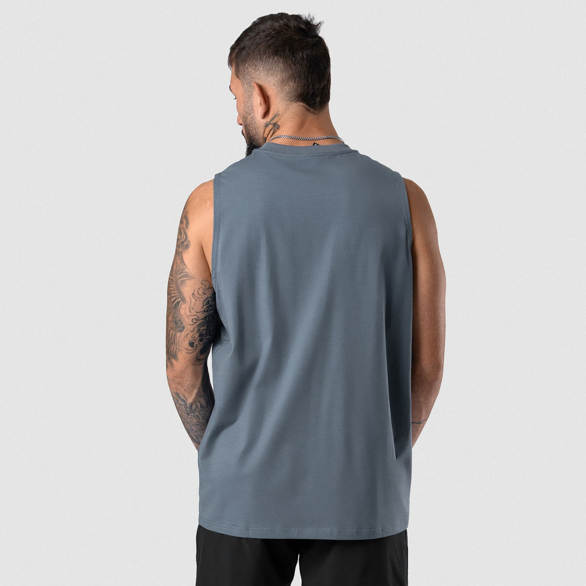 Man wearing Axis Muscle Tank - Lake back fit