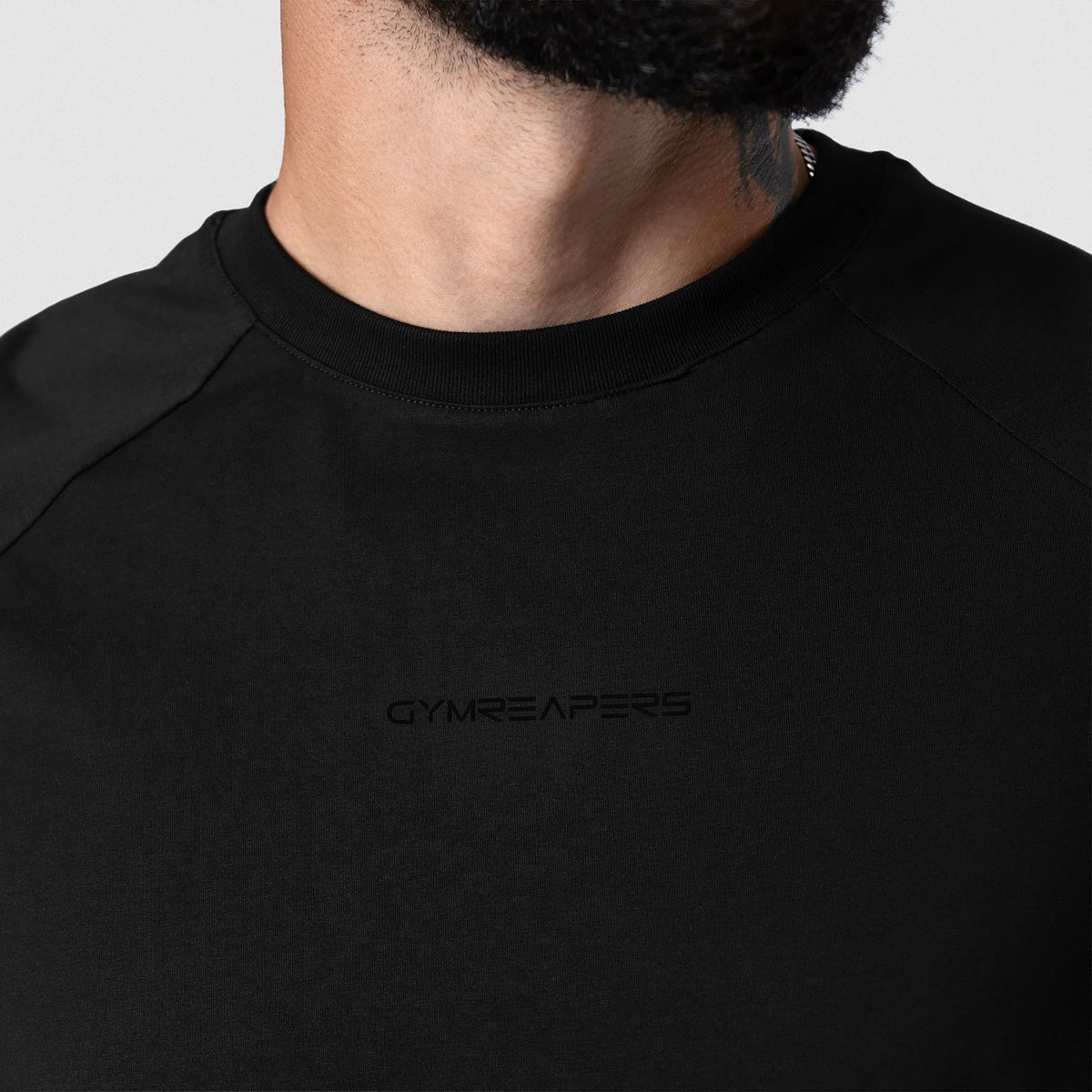 Axis Raglan Tee - Black/Black neckline and chest logo detail