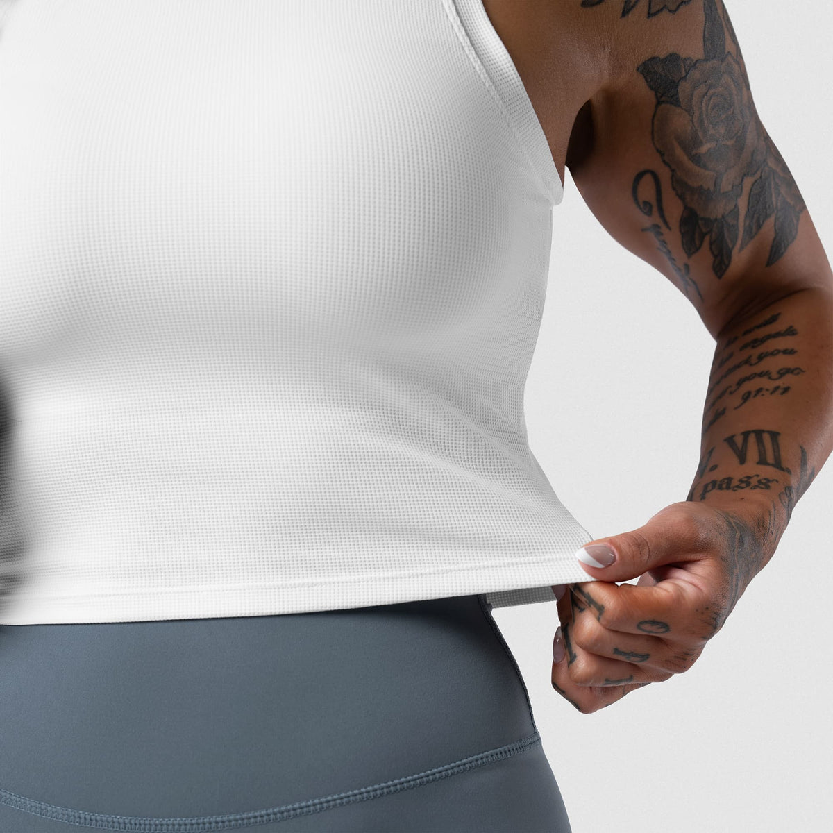 Axis Support Baby Tee - White side hem stretch detail
