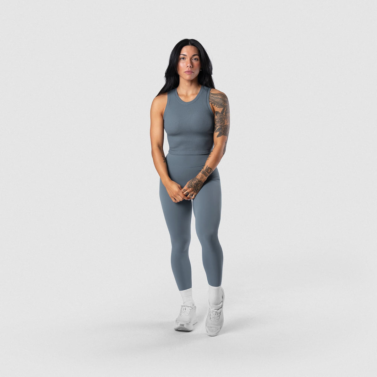Female model wearing the Axis Support Tank - Lake full-body view