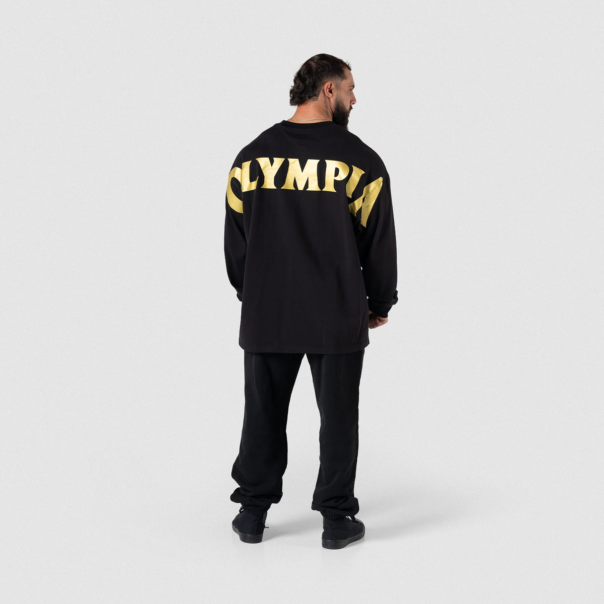 Back view of Olympia Champions Gold Jogger paired with Olympia long sleeve tee