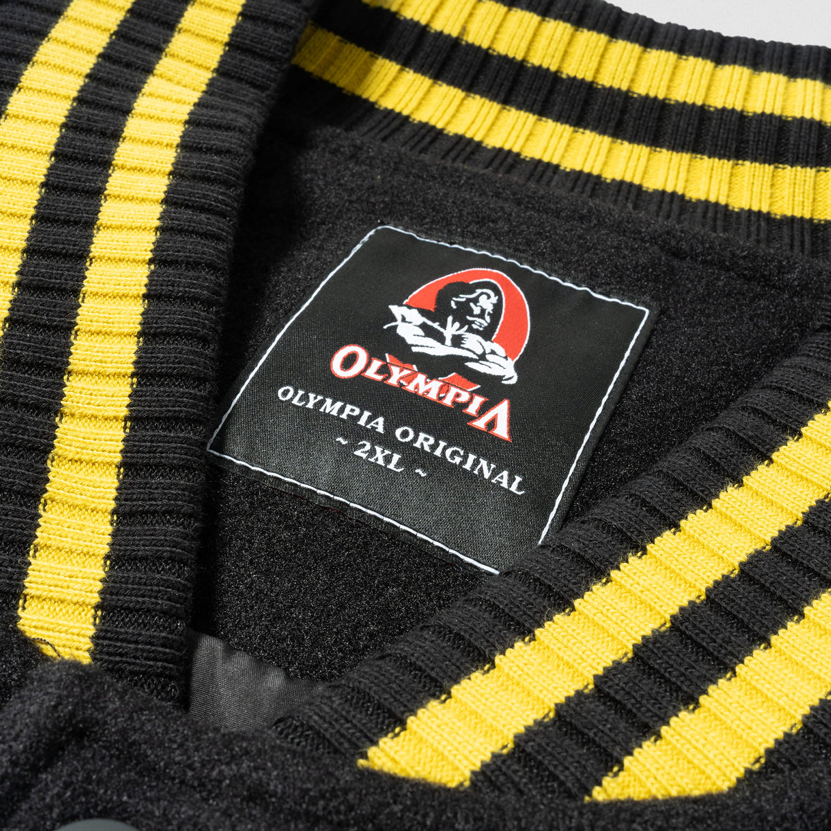 Olympia Champions Gold Varsity Jacket in Black – Collar Patch and Striped Trim Detail