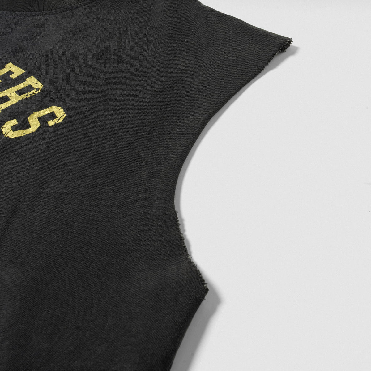 Close up or cut off sleeve arm hole edges of the Joes Olympia Cut-Off tank