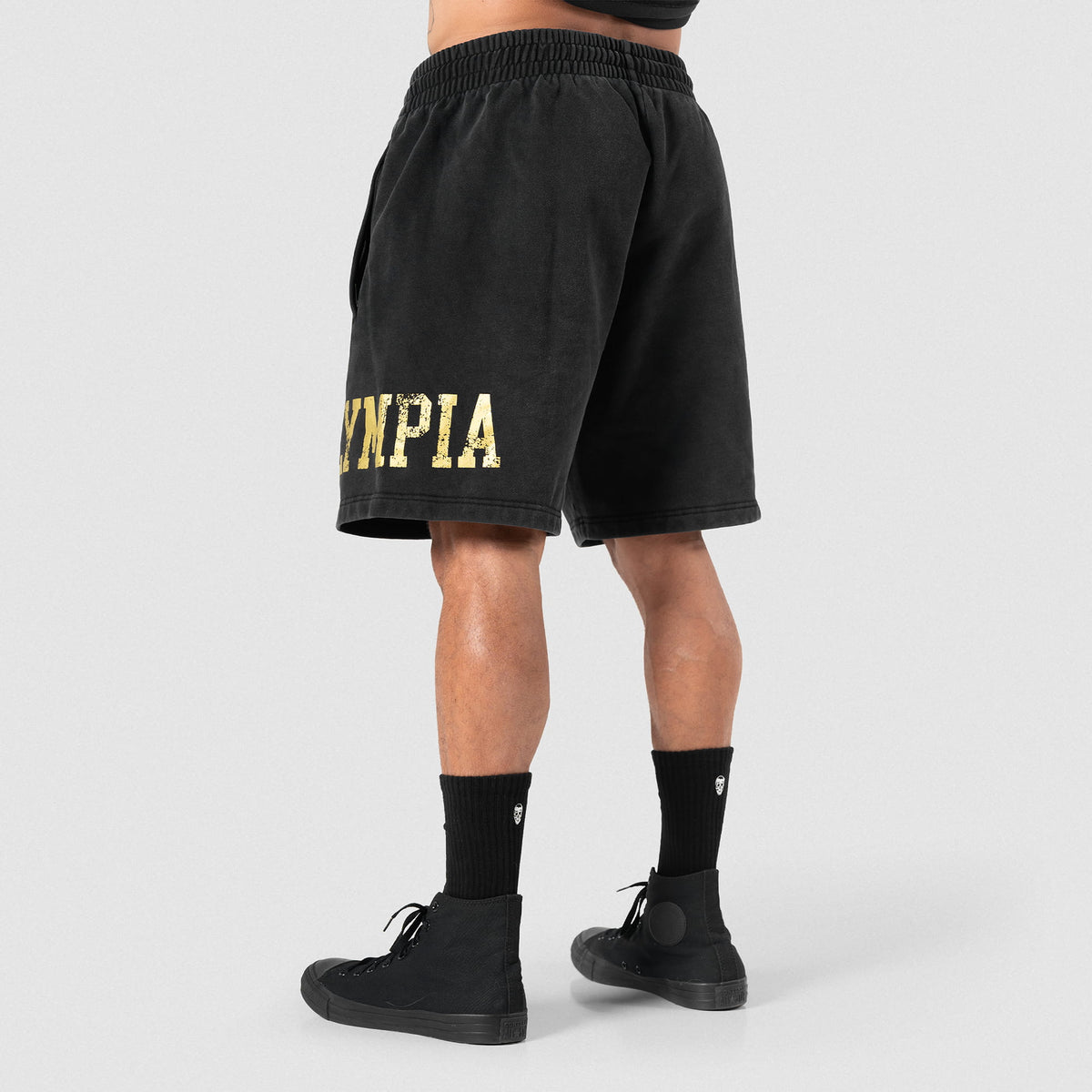 Angled view of male model wearing the Joes Olympia Sweatshort in black