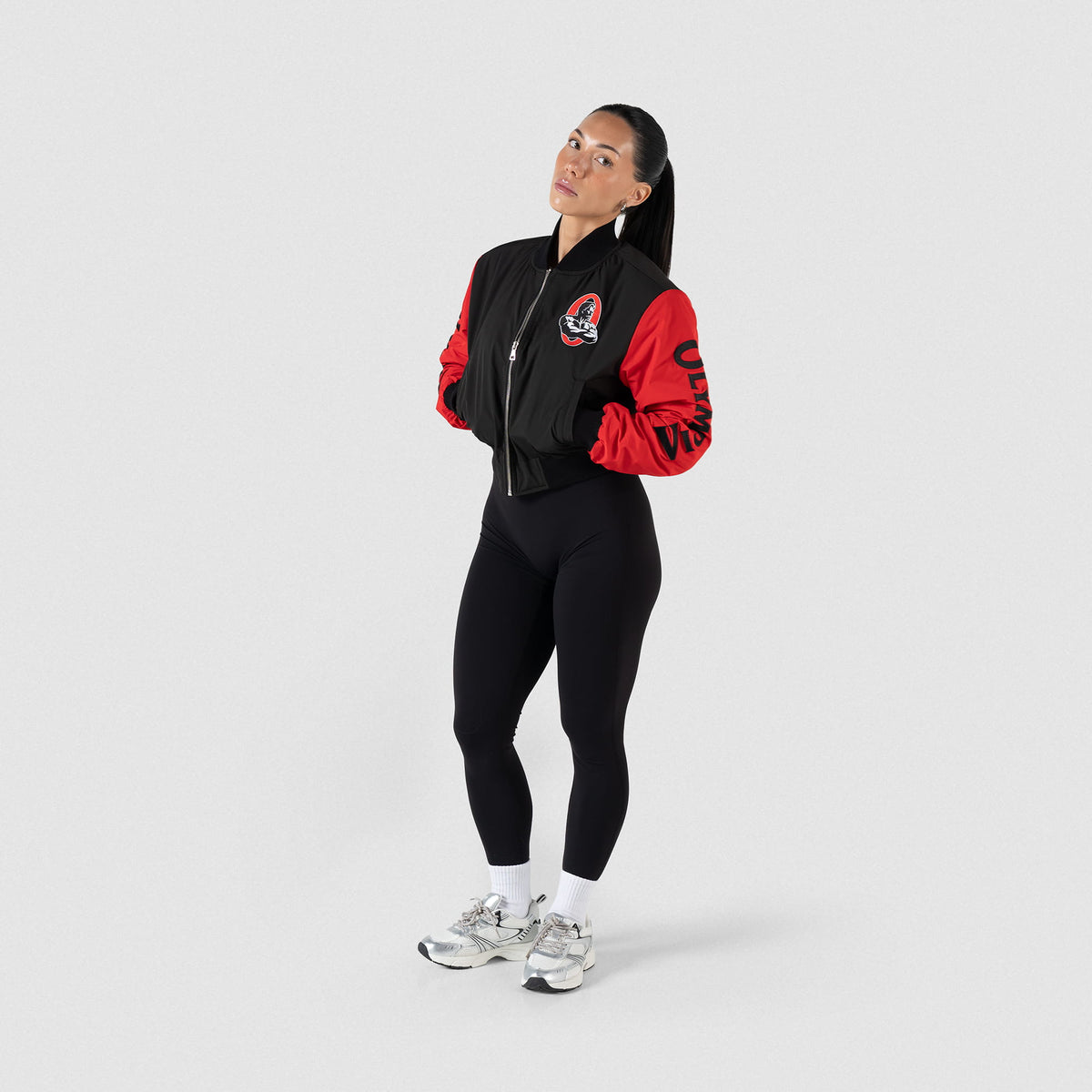 Signature Crop Bomber Jacket | Full body, on model view of Bomber Jacket, paired with leggings