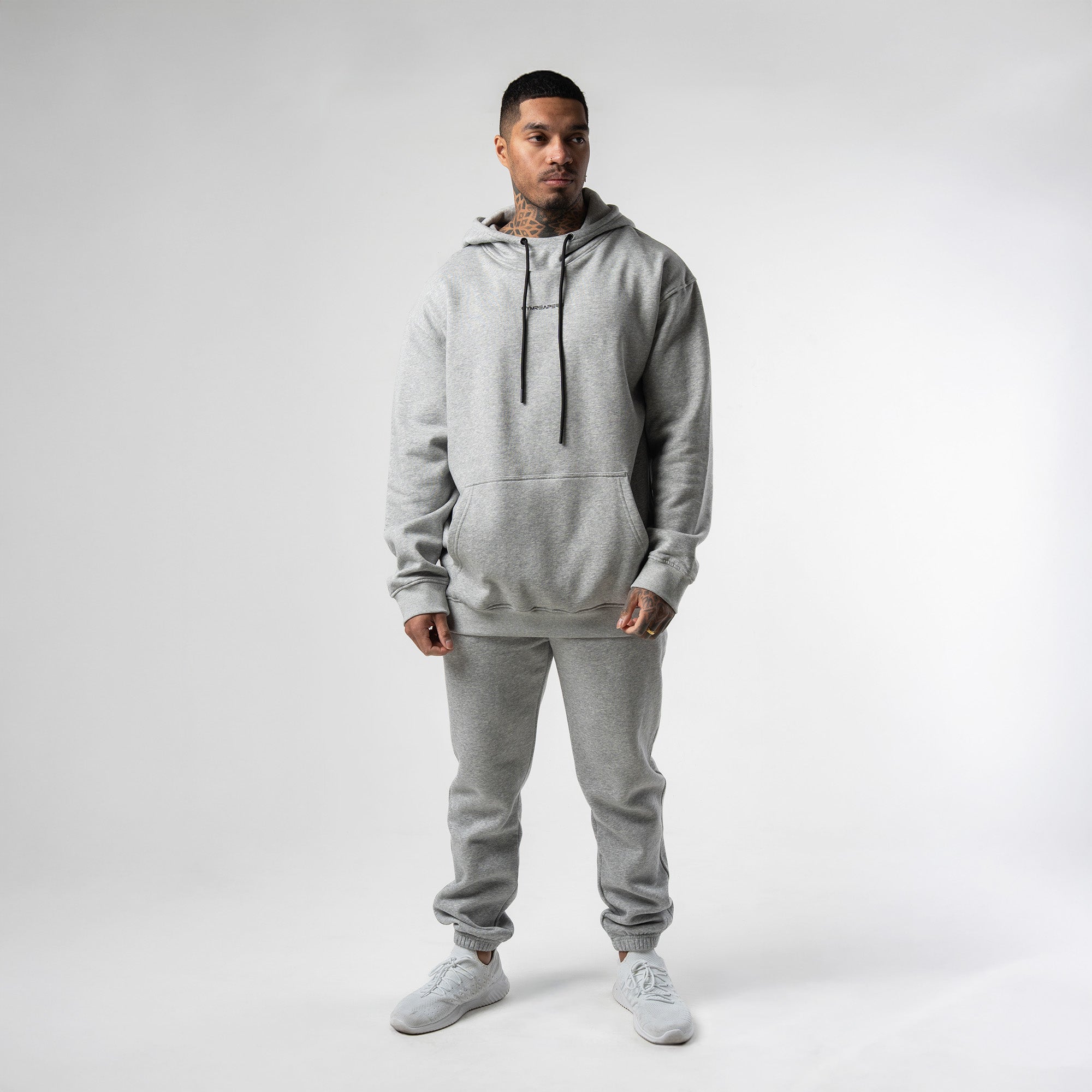 athlete wearing gray axis hoodie full body shot