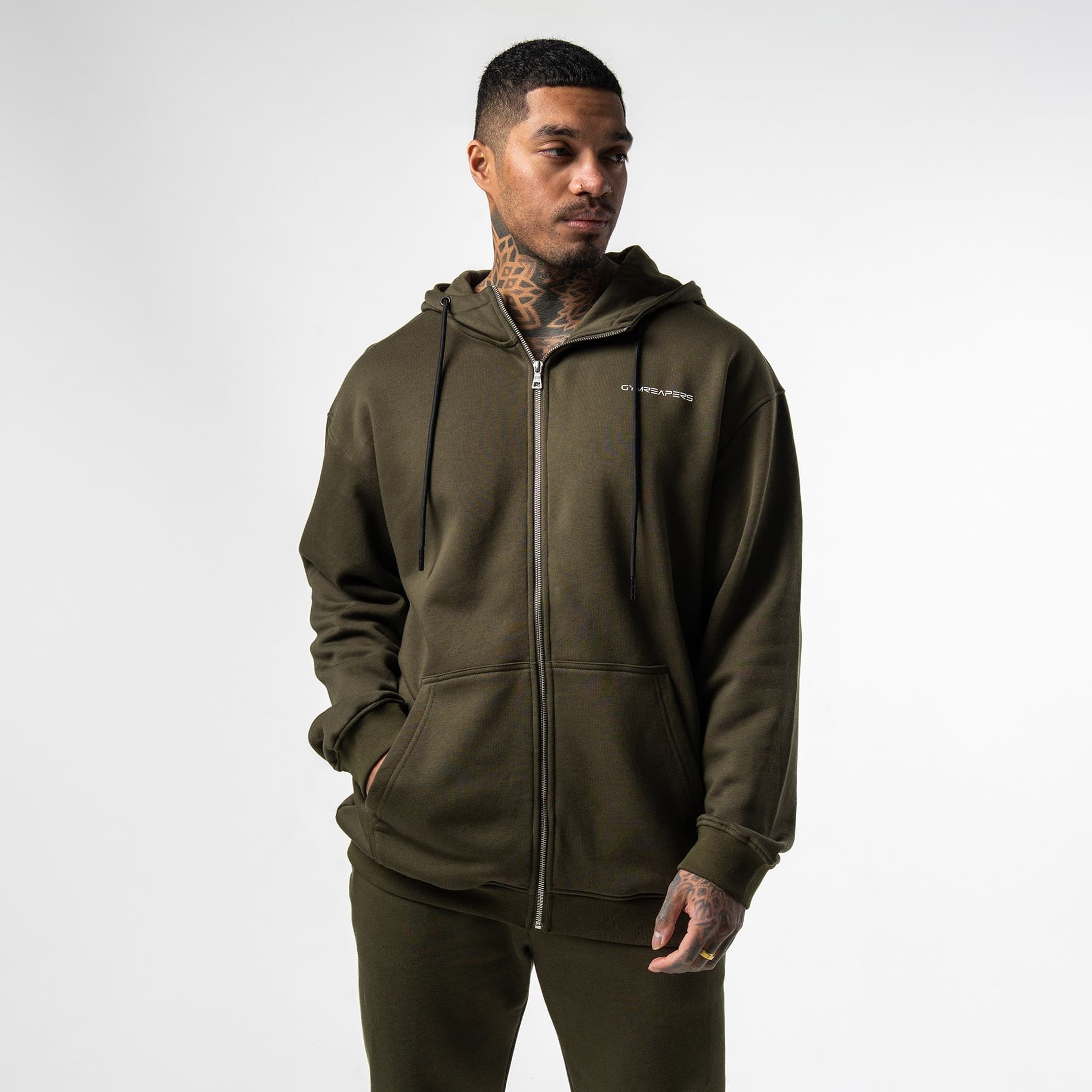 athlete wearing green axis zip up