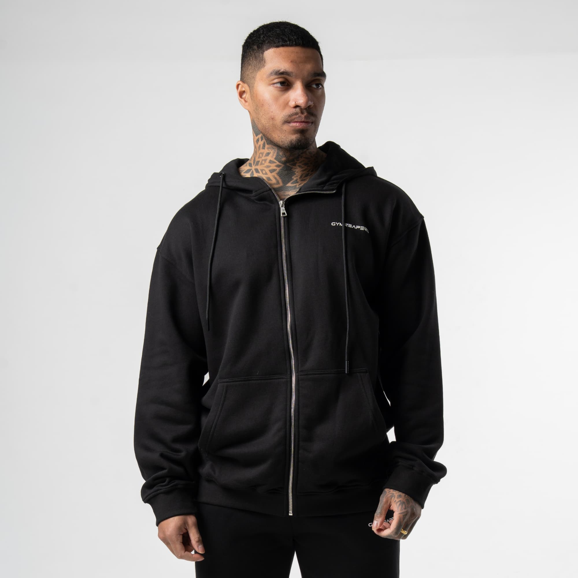 athlete wearing black/white zip up