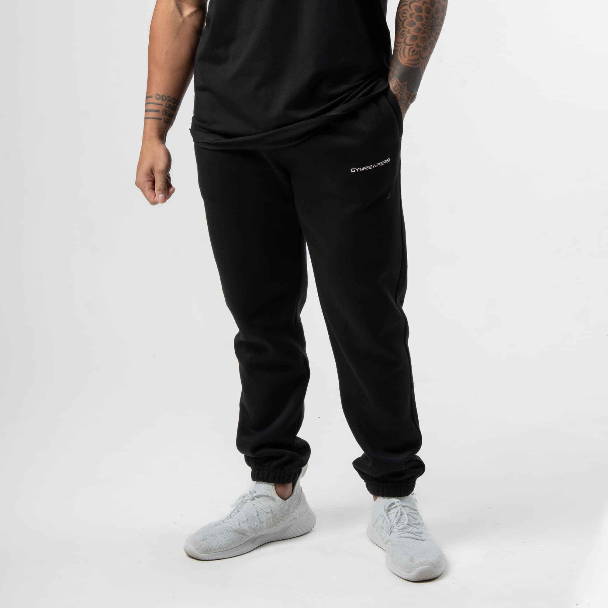 athlete wearing black/white joggers