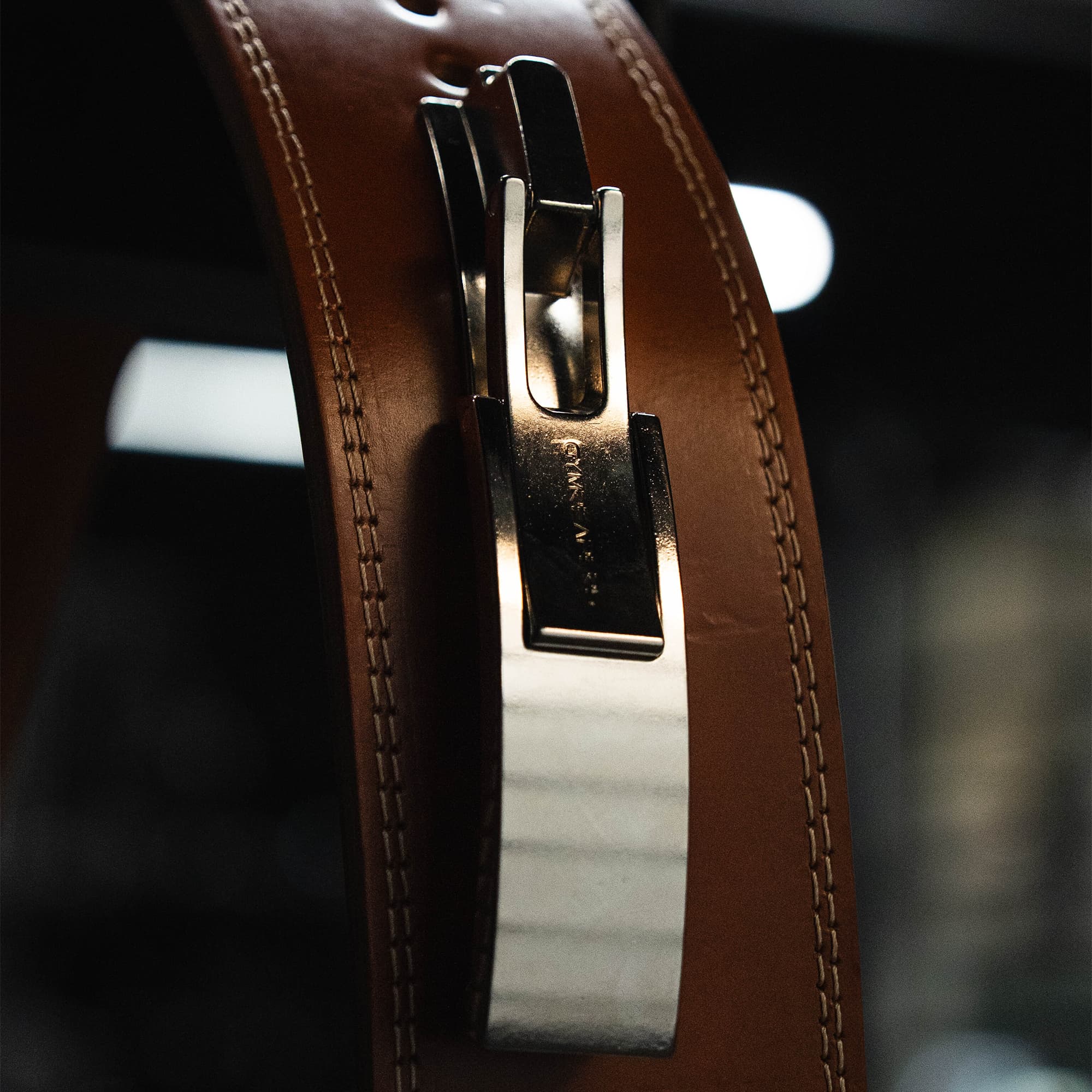 Studio shot of heritage lever belt with emphasis on the lever attachment