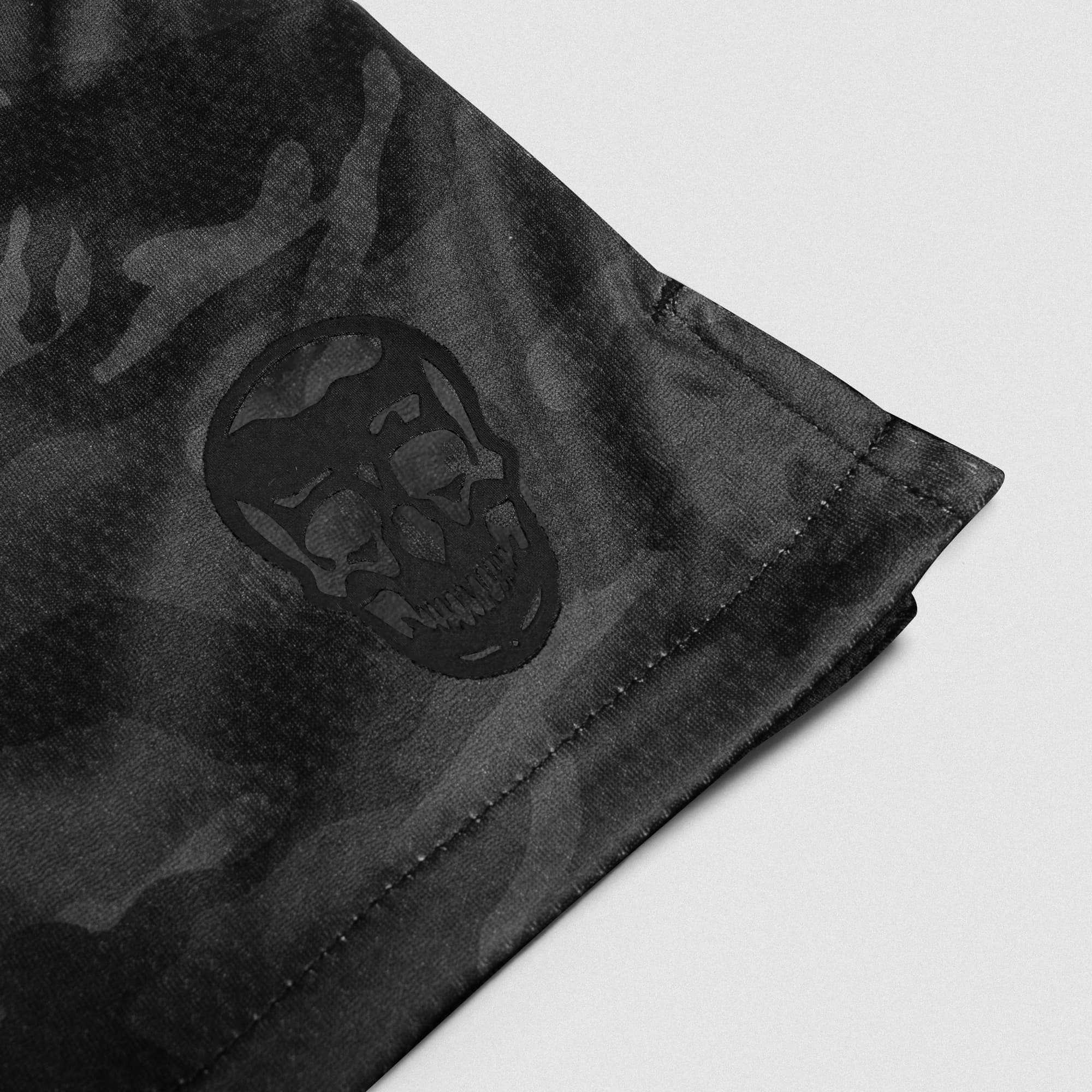 Black Camo Core Skull Mesh Training Shorts lay flat detail shot of logo