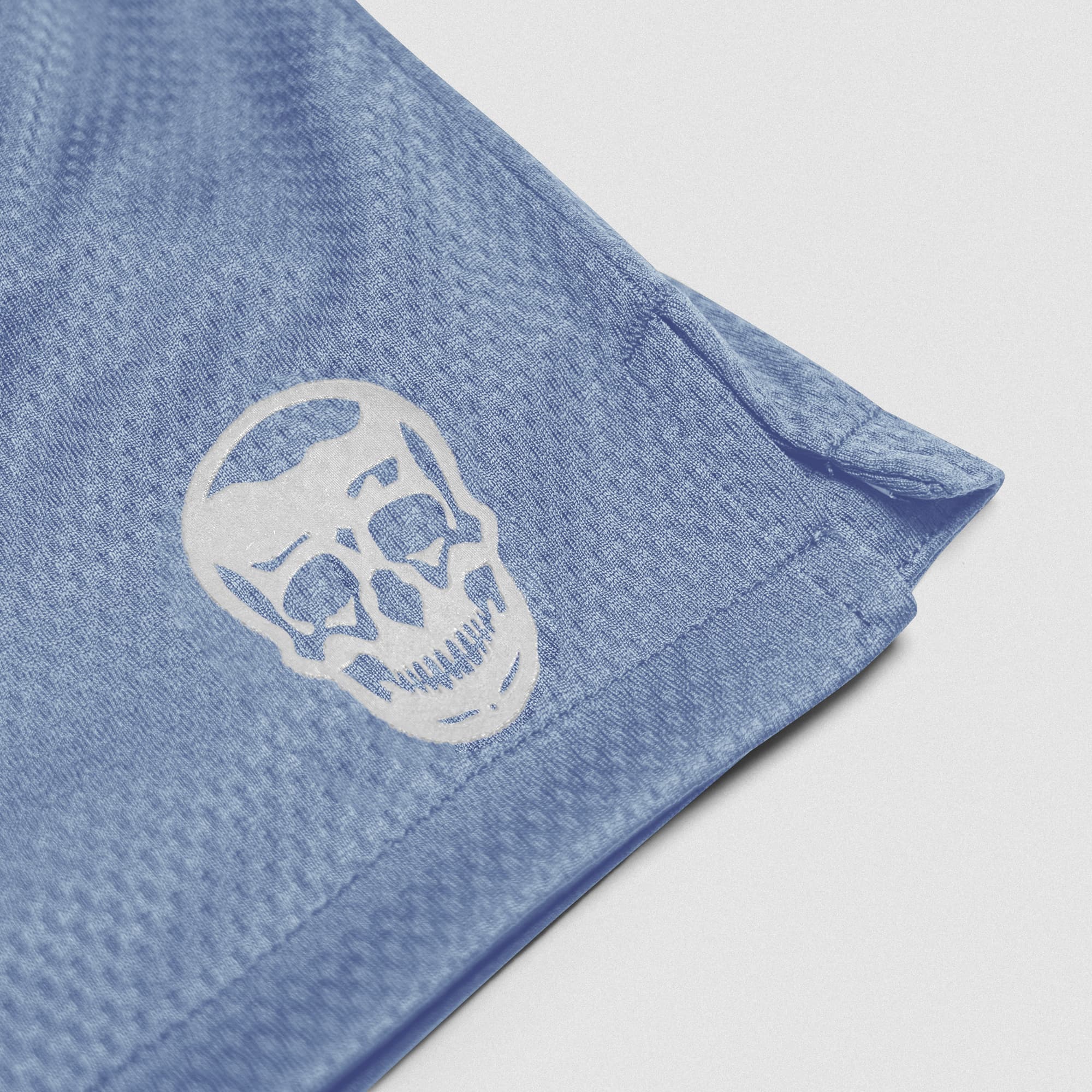 Pale Blue Core Skull Mesh Training Shorts lay flat detail shot of logo