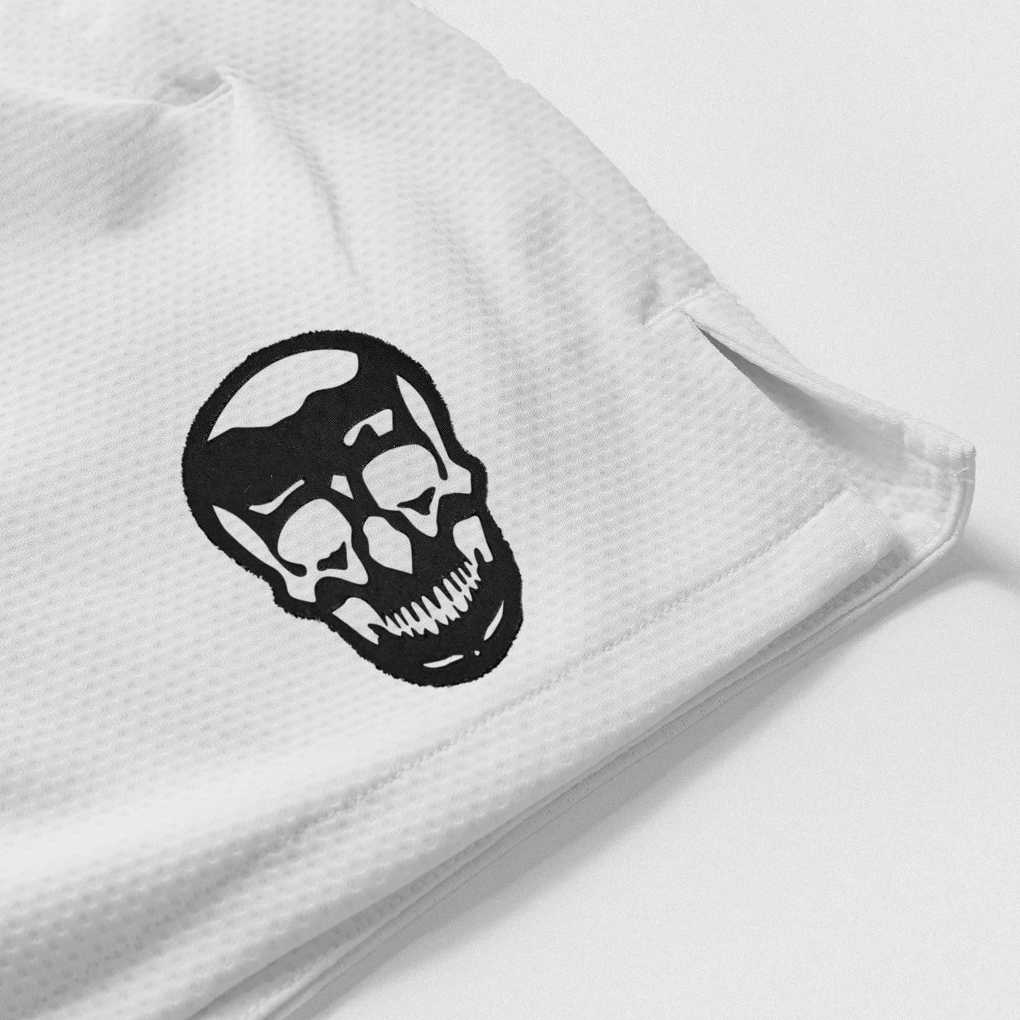 White Core Skull Mesh Training Shorts lay flat detail shot of logo