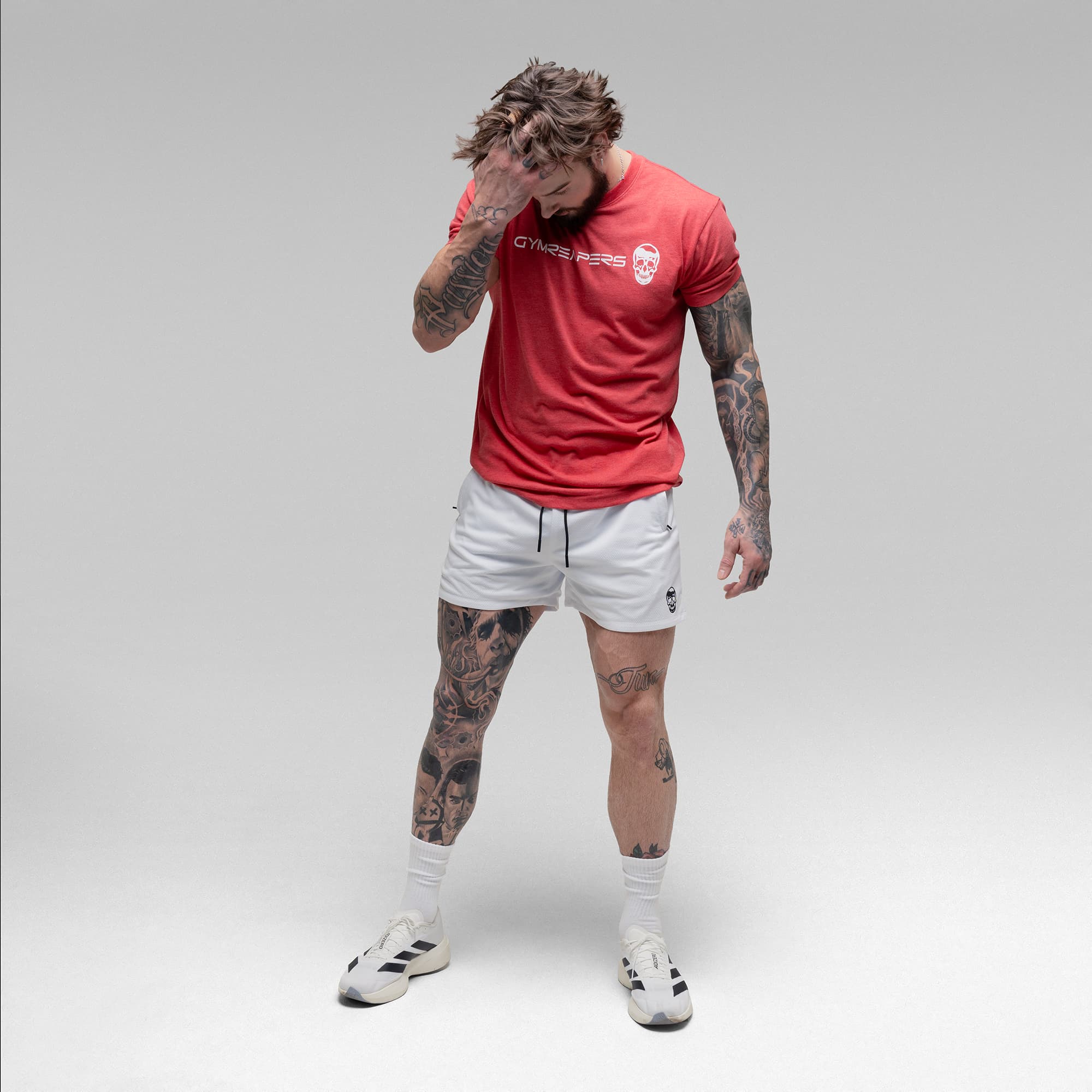 Athlete wearing the White Core Skull Mesh Training Shorts full body shot front view