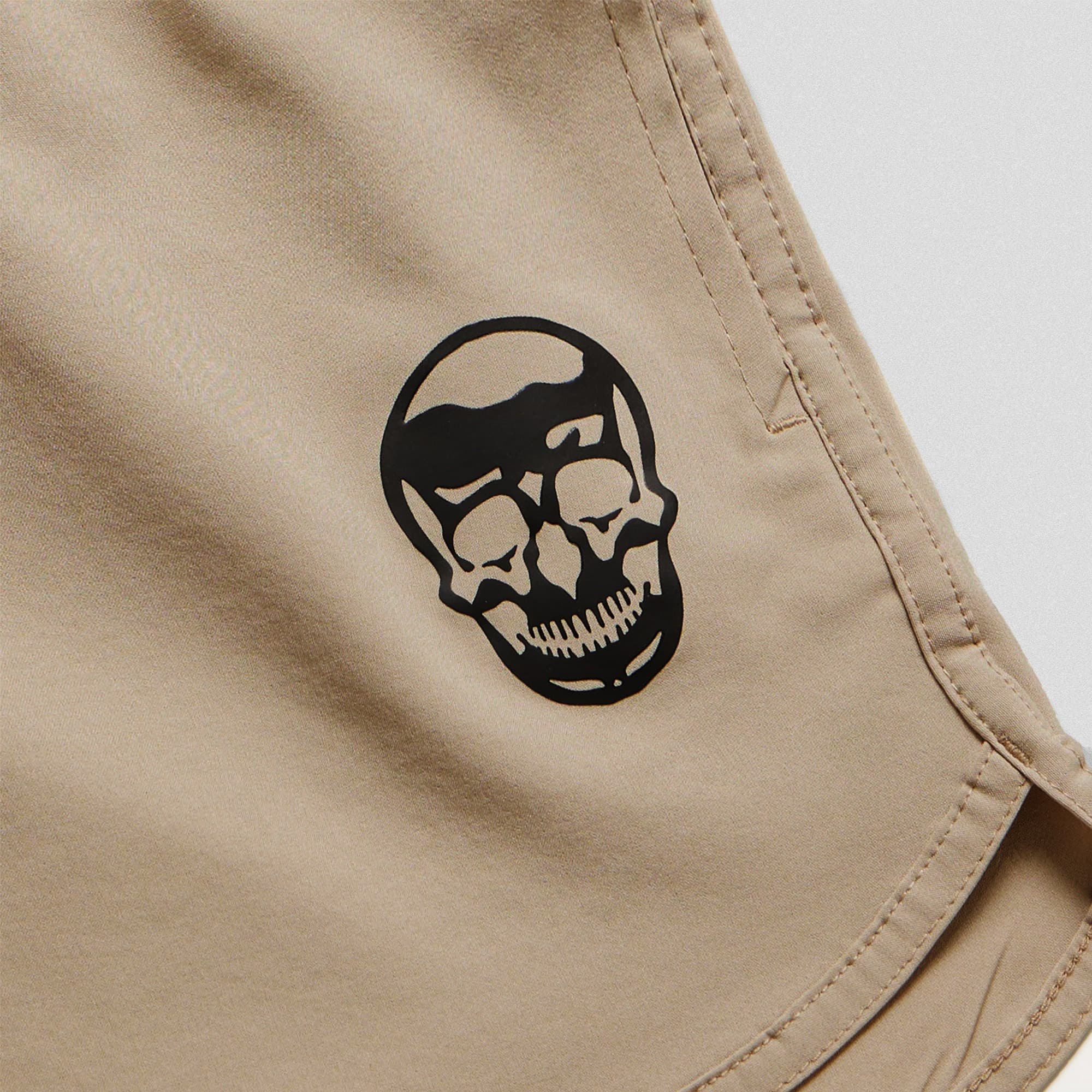 sand training shorts close up shot of logo