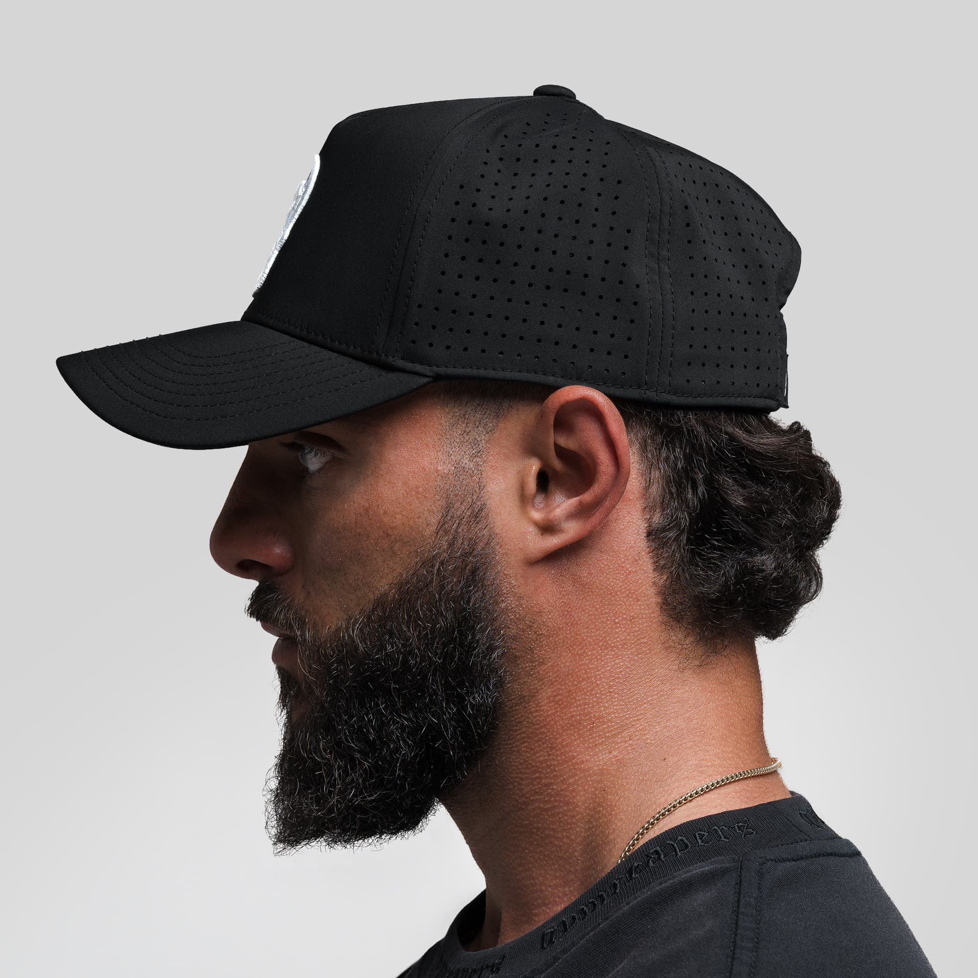 Athlete wearing Hybrid Performance 5-Panel Hat - Black/White side view