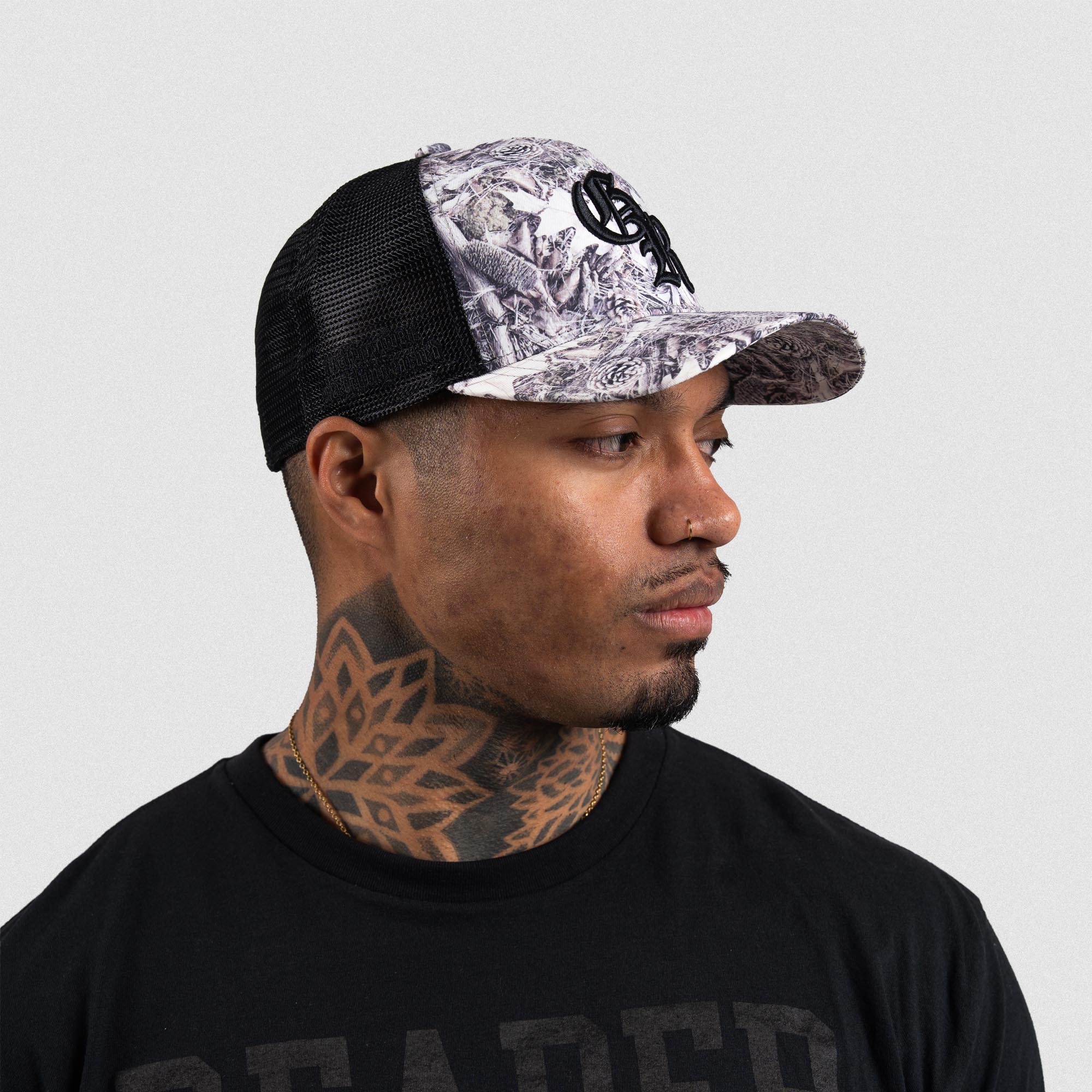 Athlete wearing Camo 5-Panel Initial Trucker Hat right side view