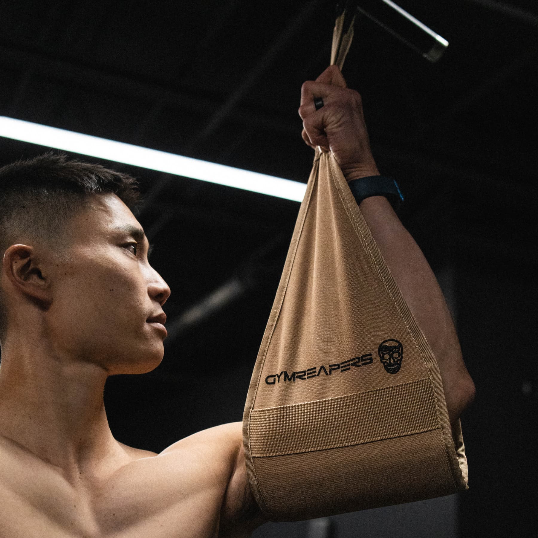 Close up shot of athlete using the Gymreapers Ab Straps