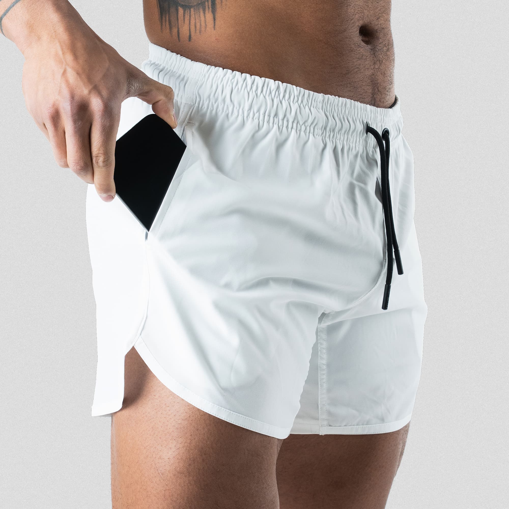 training shorts white pocket studio shot