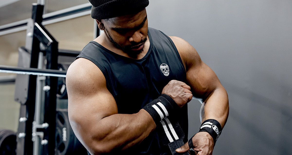 IFBB pro bodybuilder putting on Gymreapers best wrist wraps