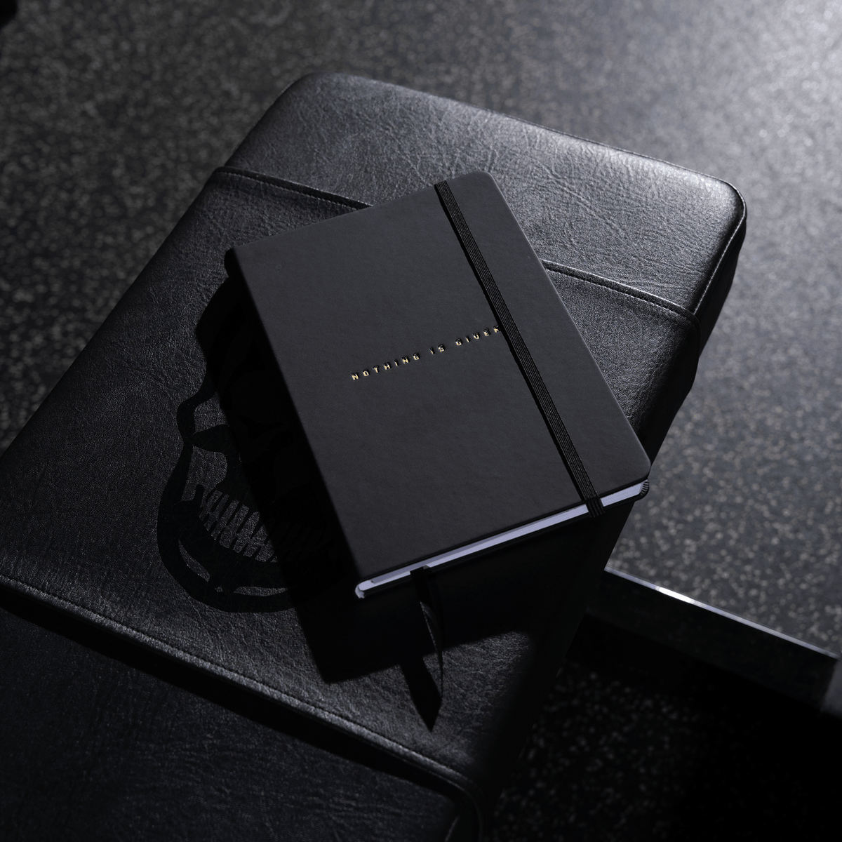 Women's Workout Journal in Black – Lifestyle, Resting on Bench