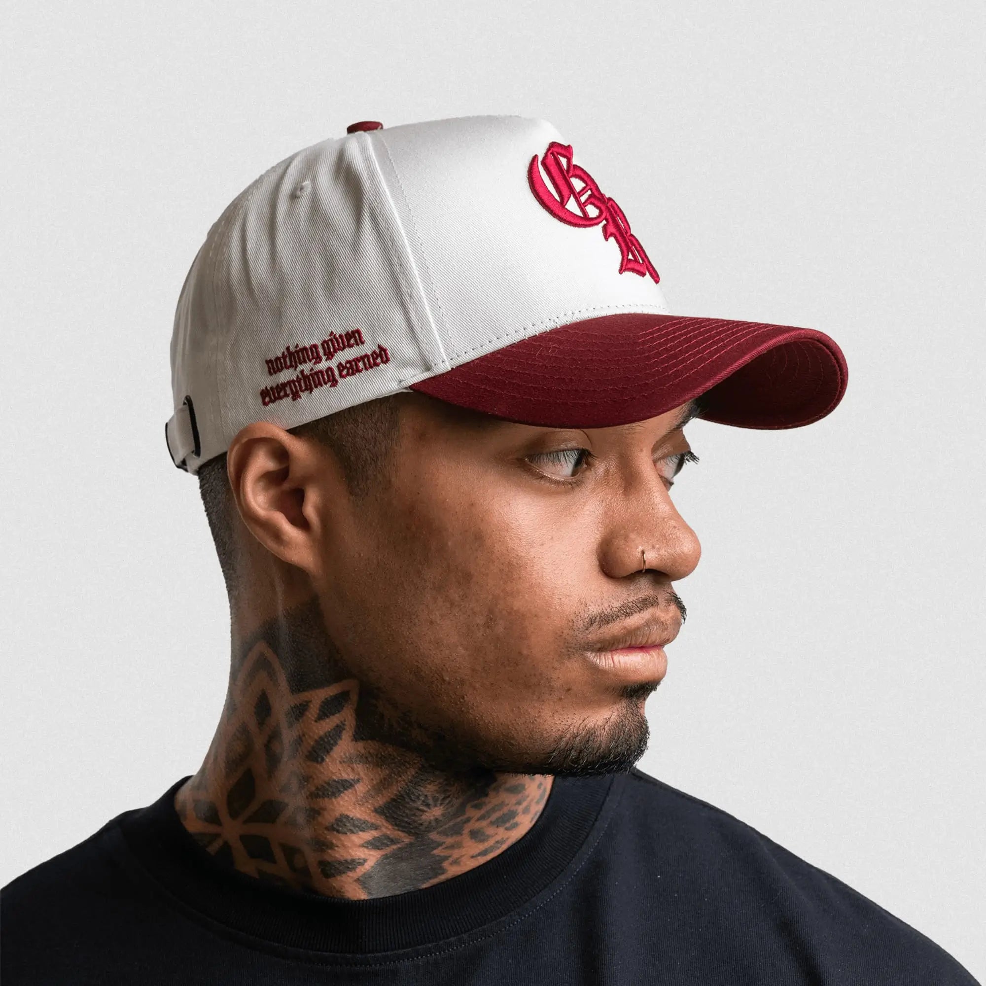 5 panel initial hat white maroon mantra side view on athlete gray background