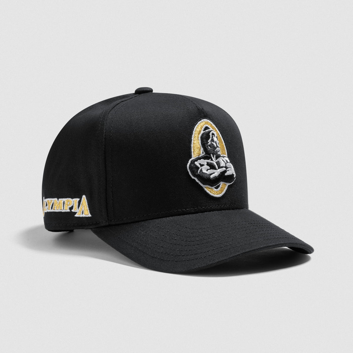 Front of Champions Gold Hat that shows the Champions Gold Olympia Logo on the front and the Olympia wordmark on the side