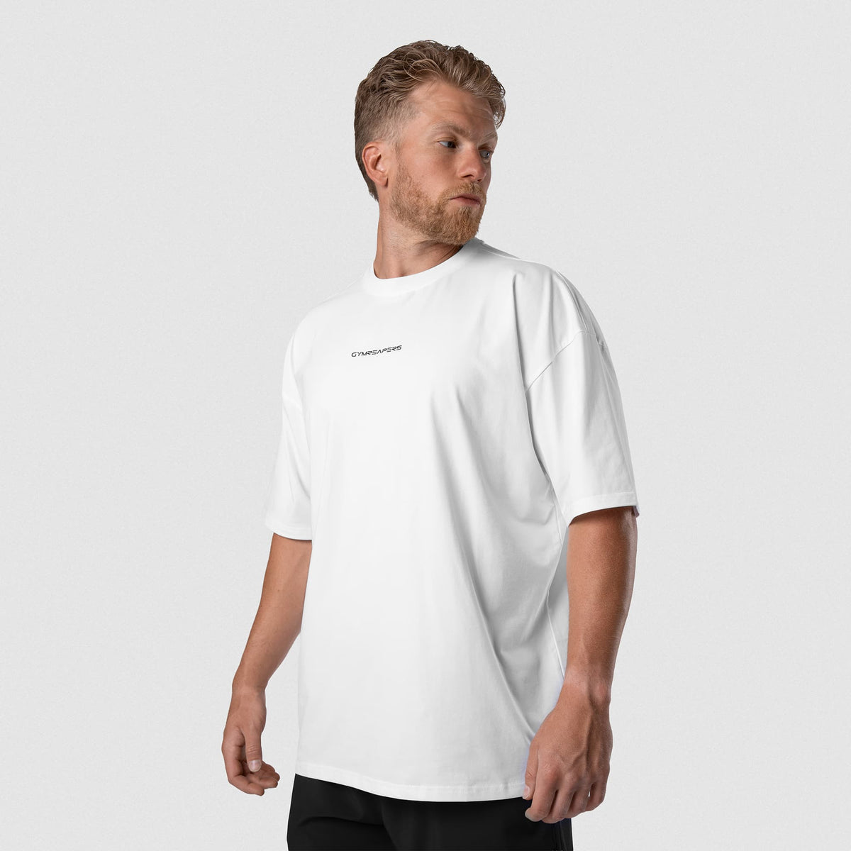 Male model wearing the Axis Box Tee - White front view