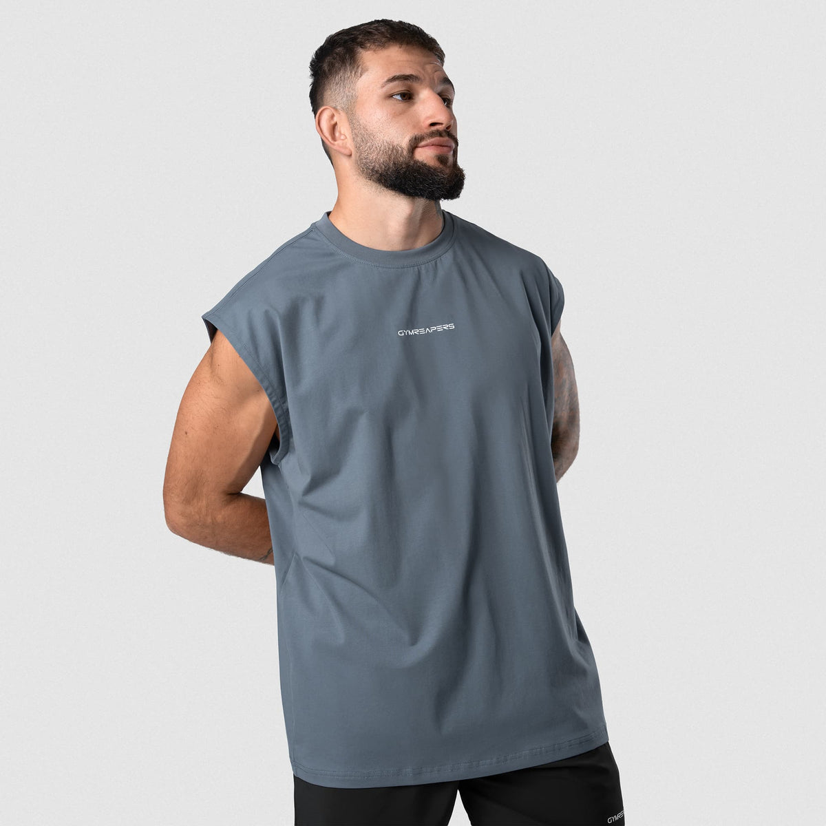 Man wearing Axis Cap Sleeve Tank - Lake front fit