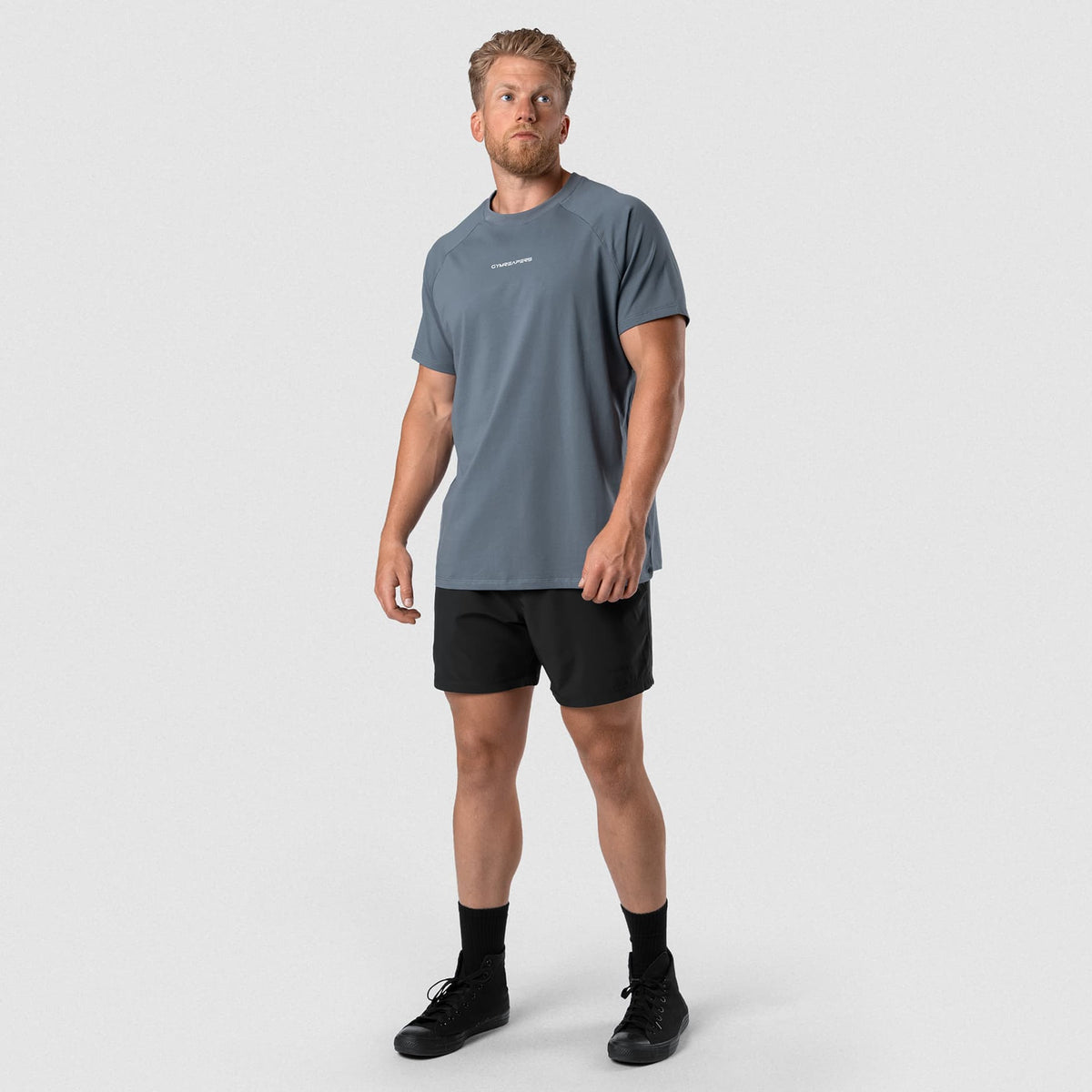 Male model wearing the Axis Raglan Tee - Lake front view