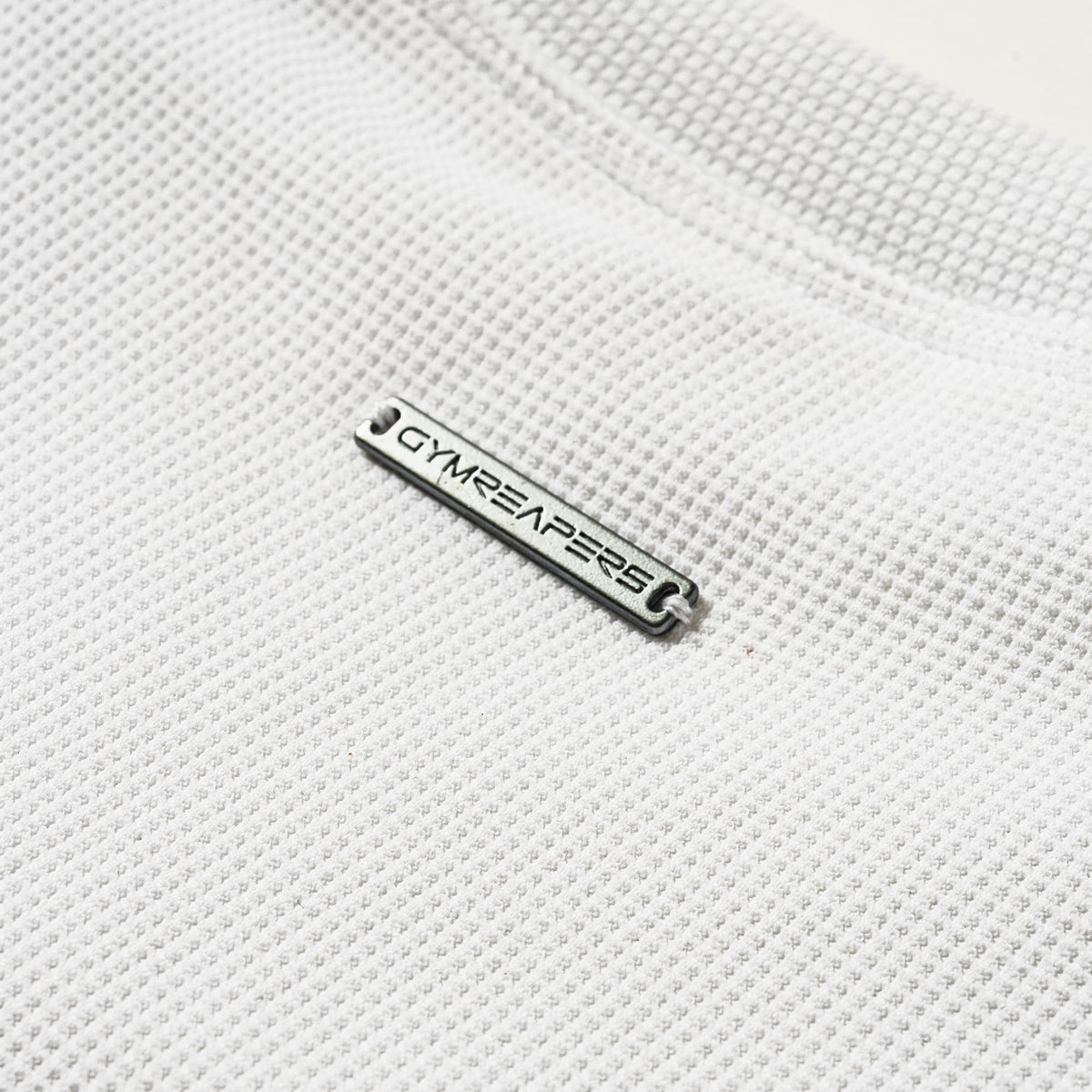 Axis Support Tank - White metal logo bar detail