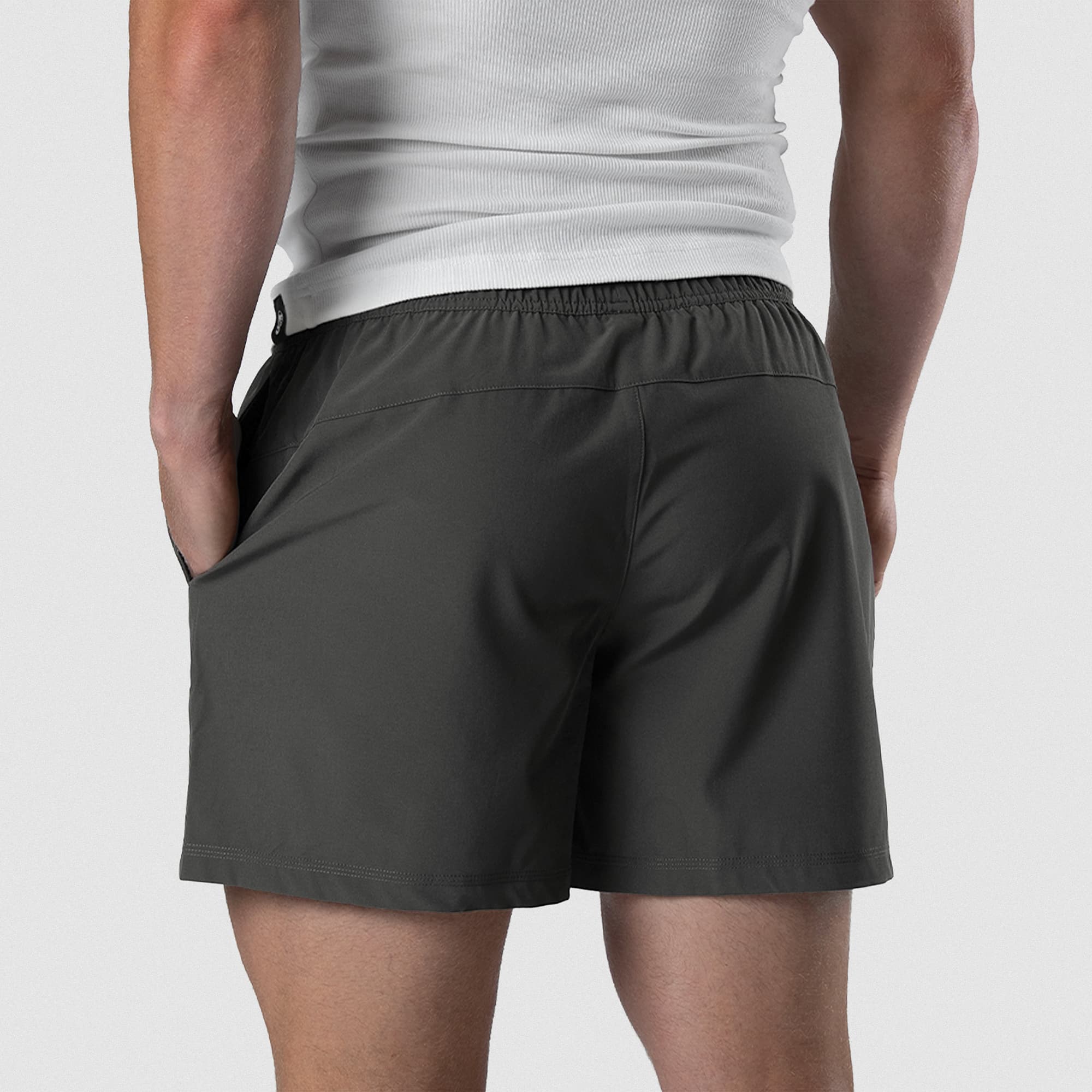 Back view of Men's Conquer 5 Inch Shorts on model - Dark Gray