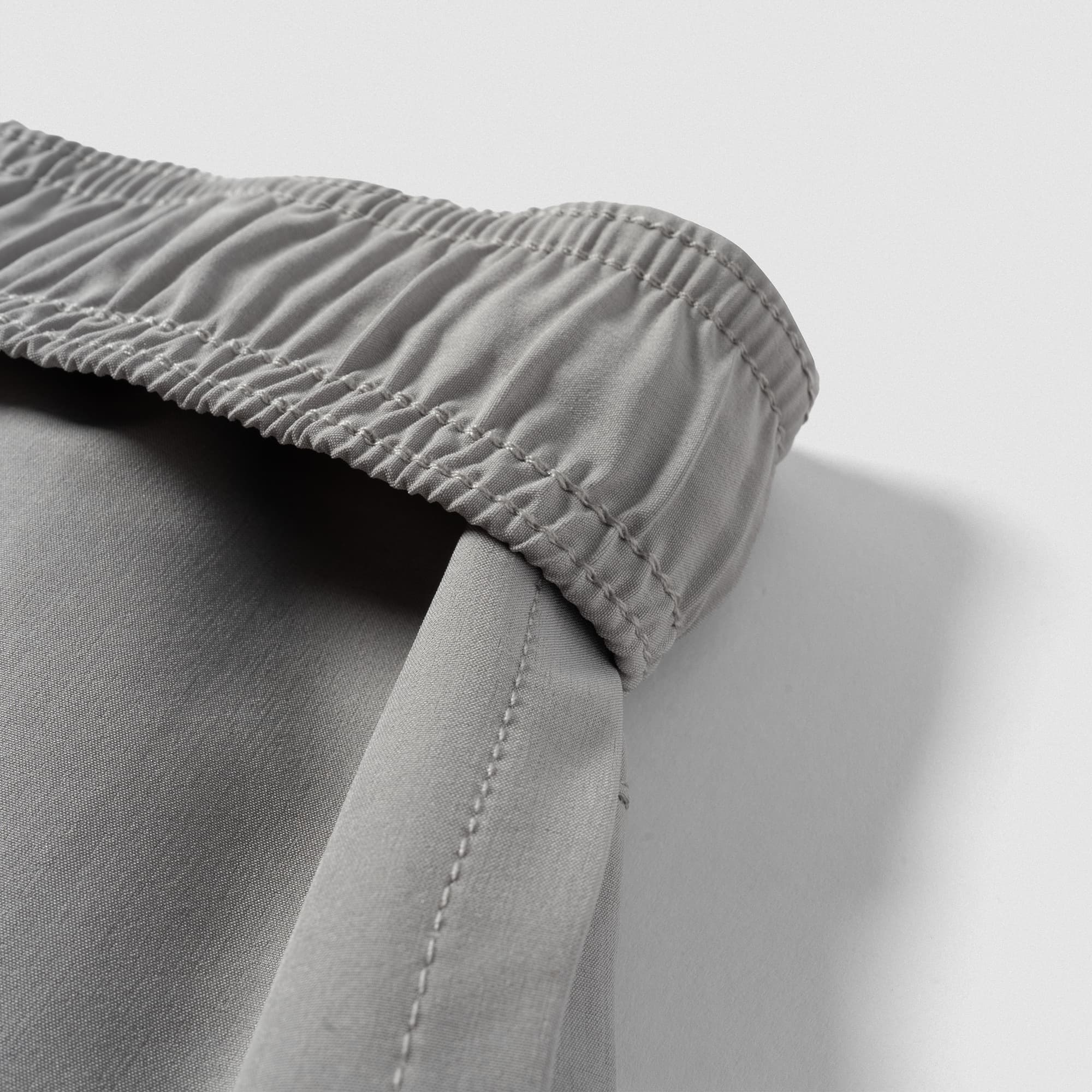 Elastic waistband detail on Men's Conquer 9 Inch Shorts - Gray