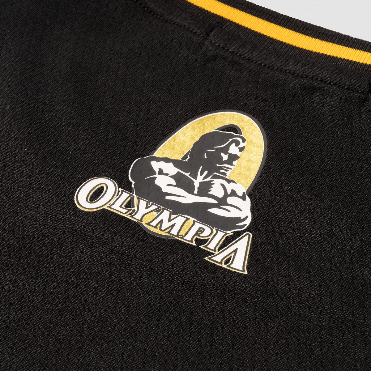 Champions Gold Crop Jersey | close up of black and gold Olympia Logo