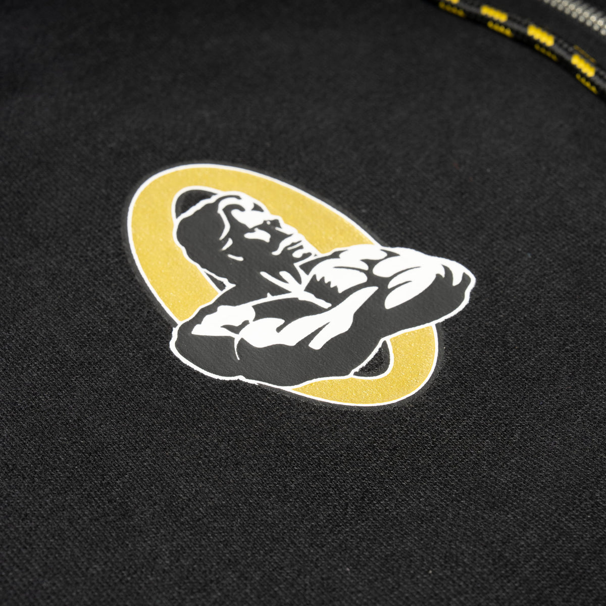 Champions Gold Zip-Up Hoodie | Small chest official Olympia Champions Gold logo in white, black, and gold