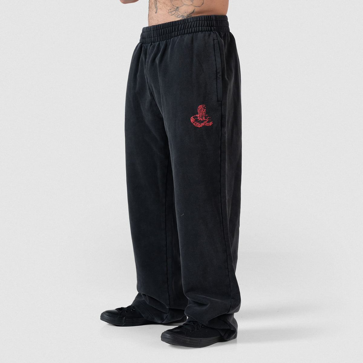 Male model angled away while wearing the Championship Straight-Leg Jogger in black