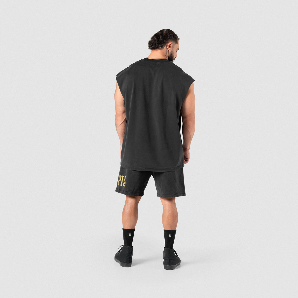 Back view of a male model wearing the Joes Olympia Cut-Off tank
