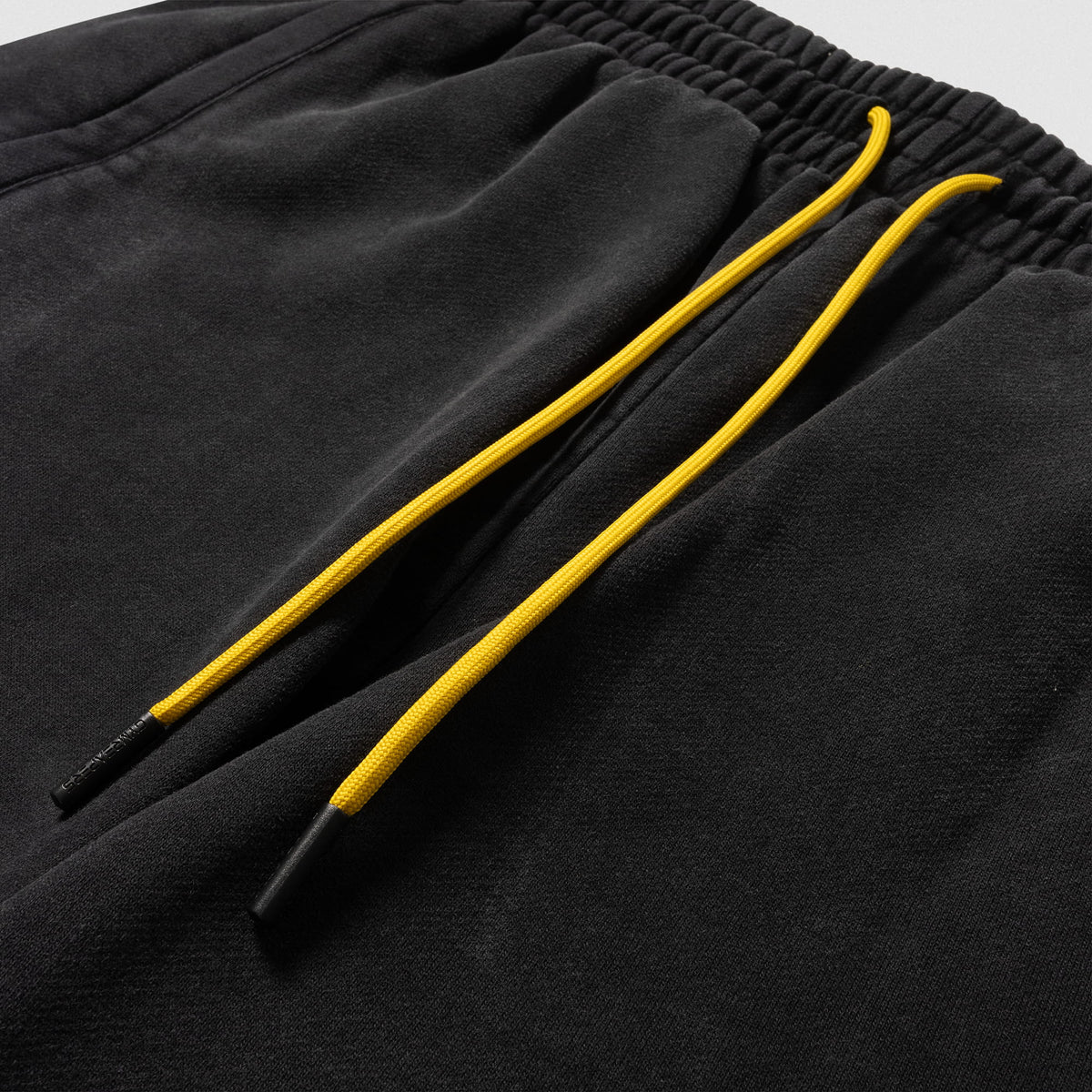Close up of gold adjustable drawstrings of the Joes Olympia Sweatshort