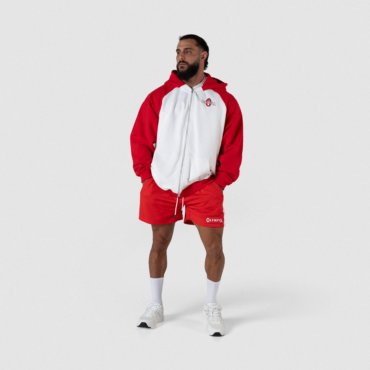Signature Zip-Up Hoodie | Male model full body pose of full zip hoodie and matching shorts in red