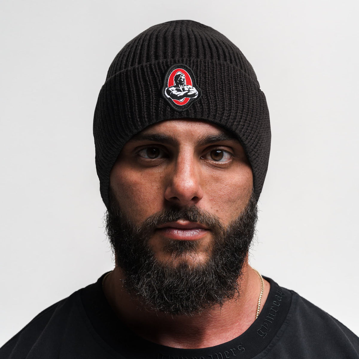 Front facing view of model wearing the Signature Ribbed Knit Beanie 