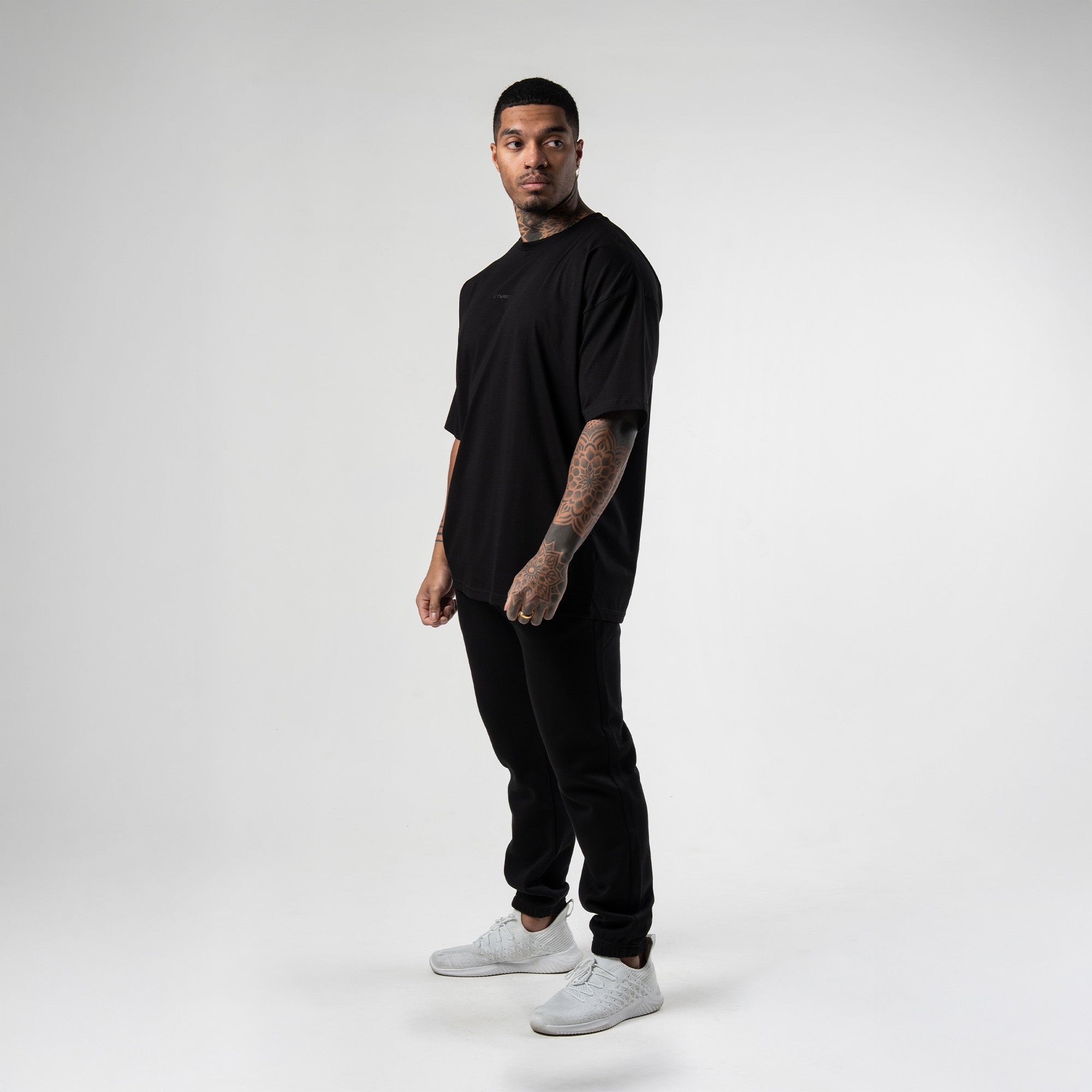 athlete wearing black axis box tee full body shot