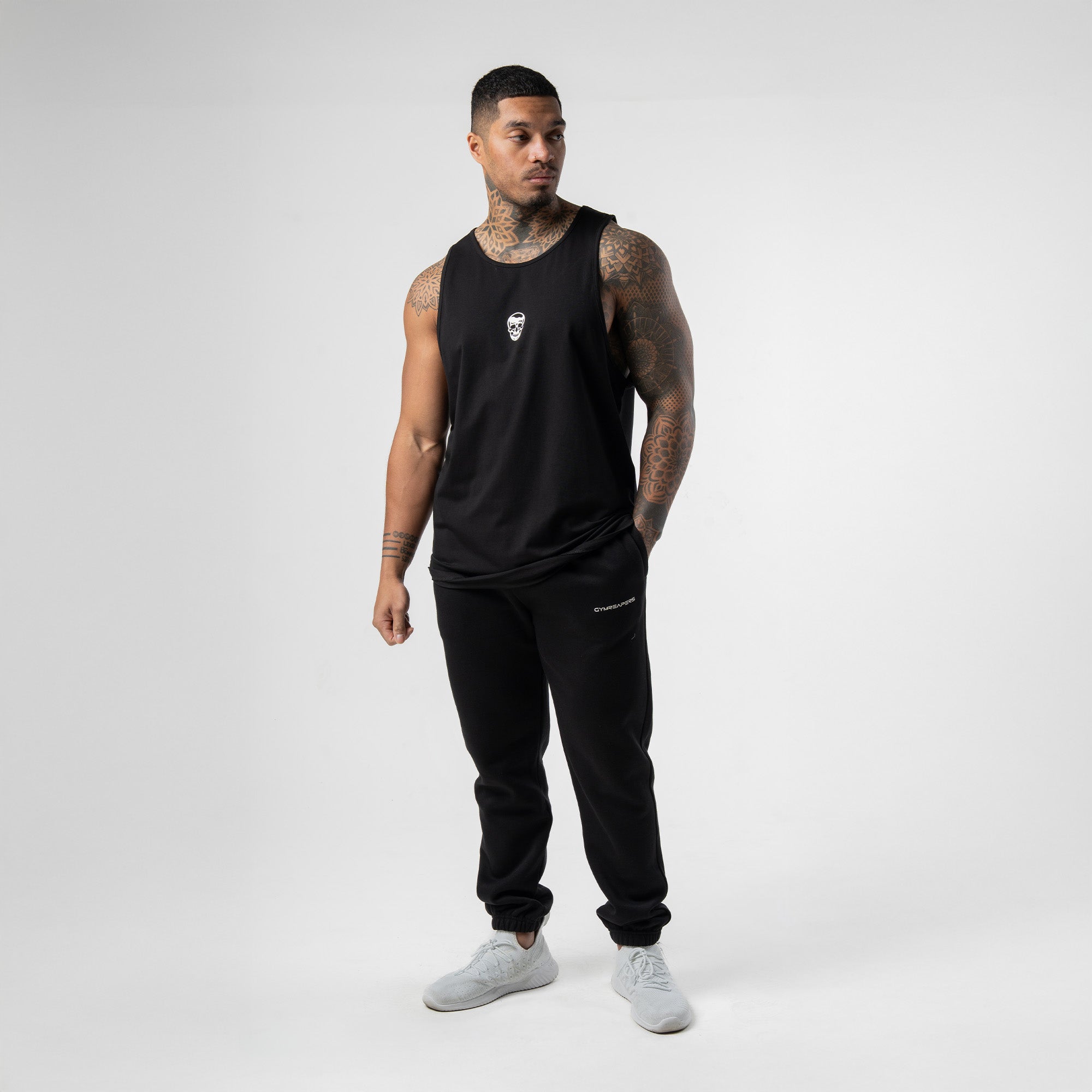 athlete wearing the black/white axis scoop hem tank full body shot