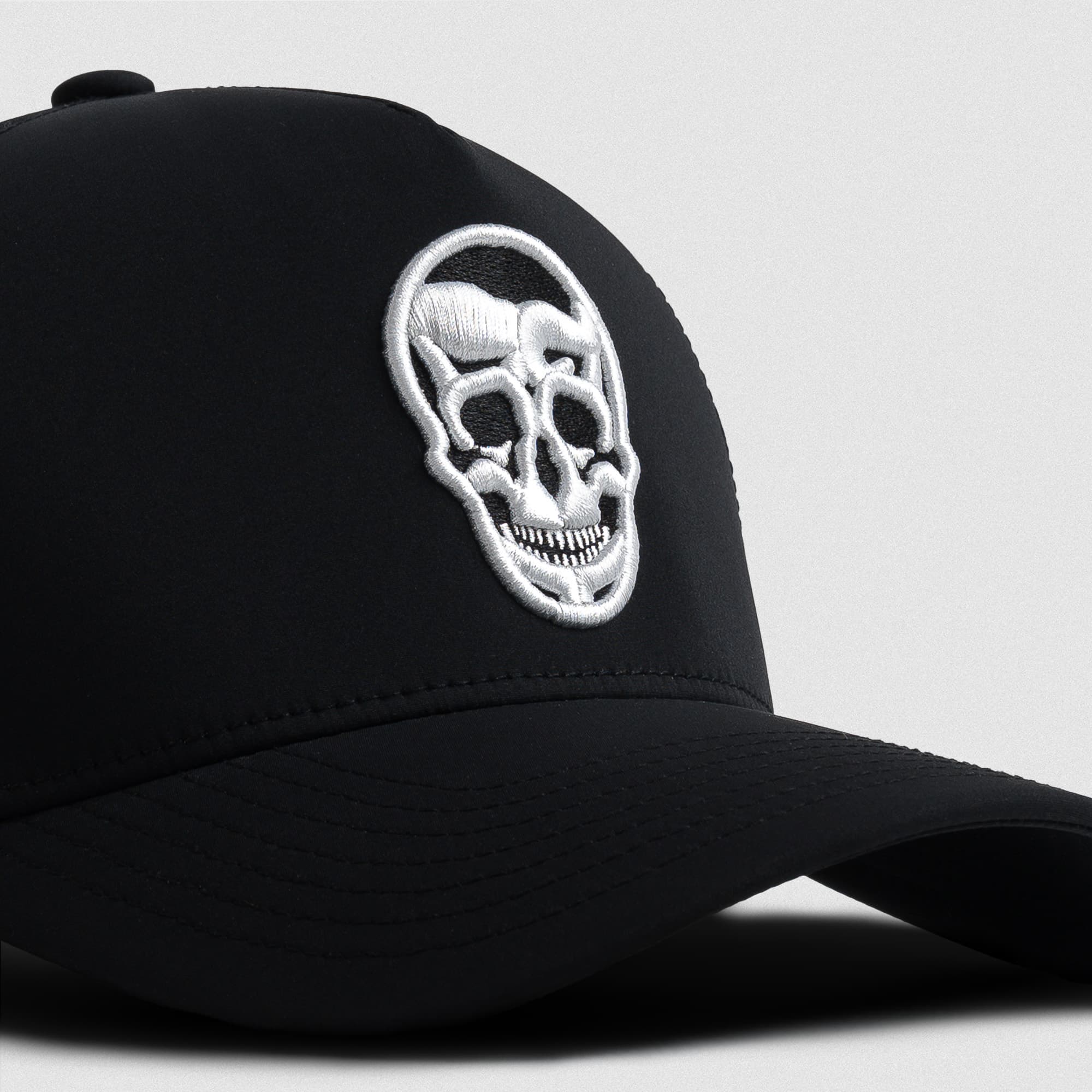 Hybrid Performance 5-Panel Hat - Black/White detail shot of logo
