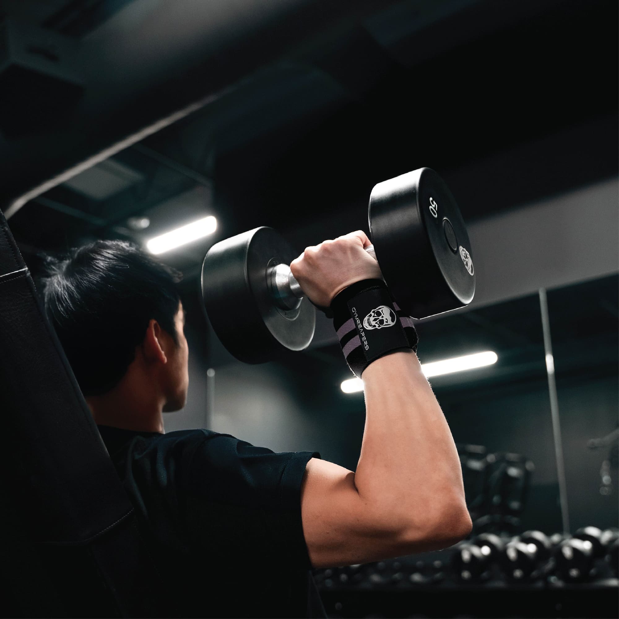 wrist wraps lilac being used in shoulder press