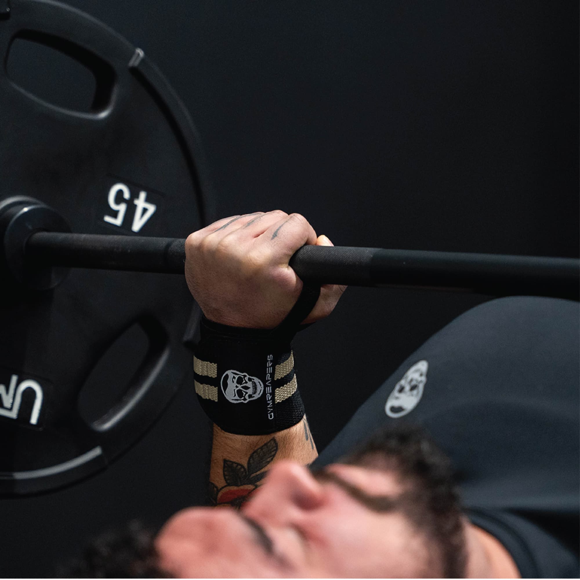 wrist wraps desert sand being used during bench press