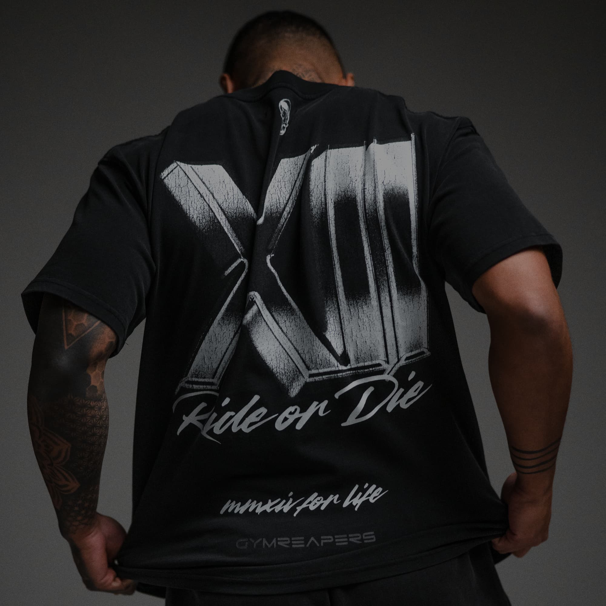 Athlete wearing 12th Anniversary Tee - Ride or Die close up image of back graphic