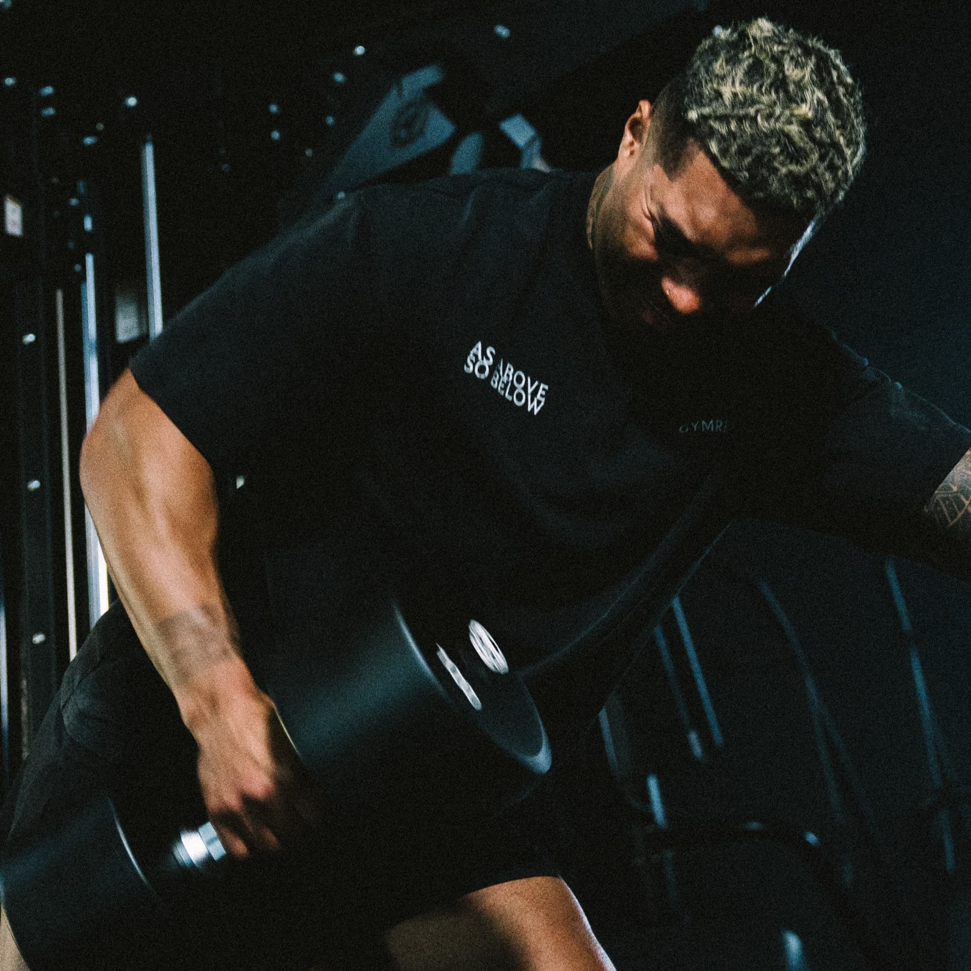 Athlete training in the black As Above So Below graphic tee, styled for gym performance and everyday wear.